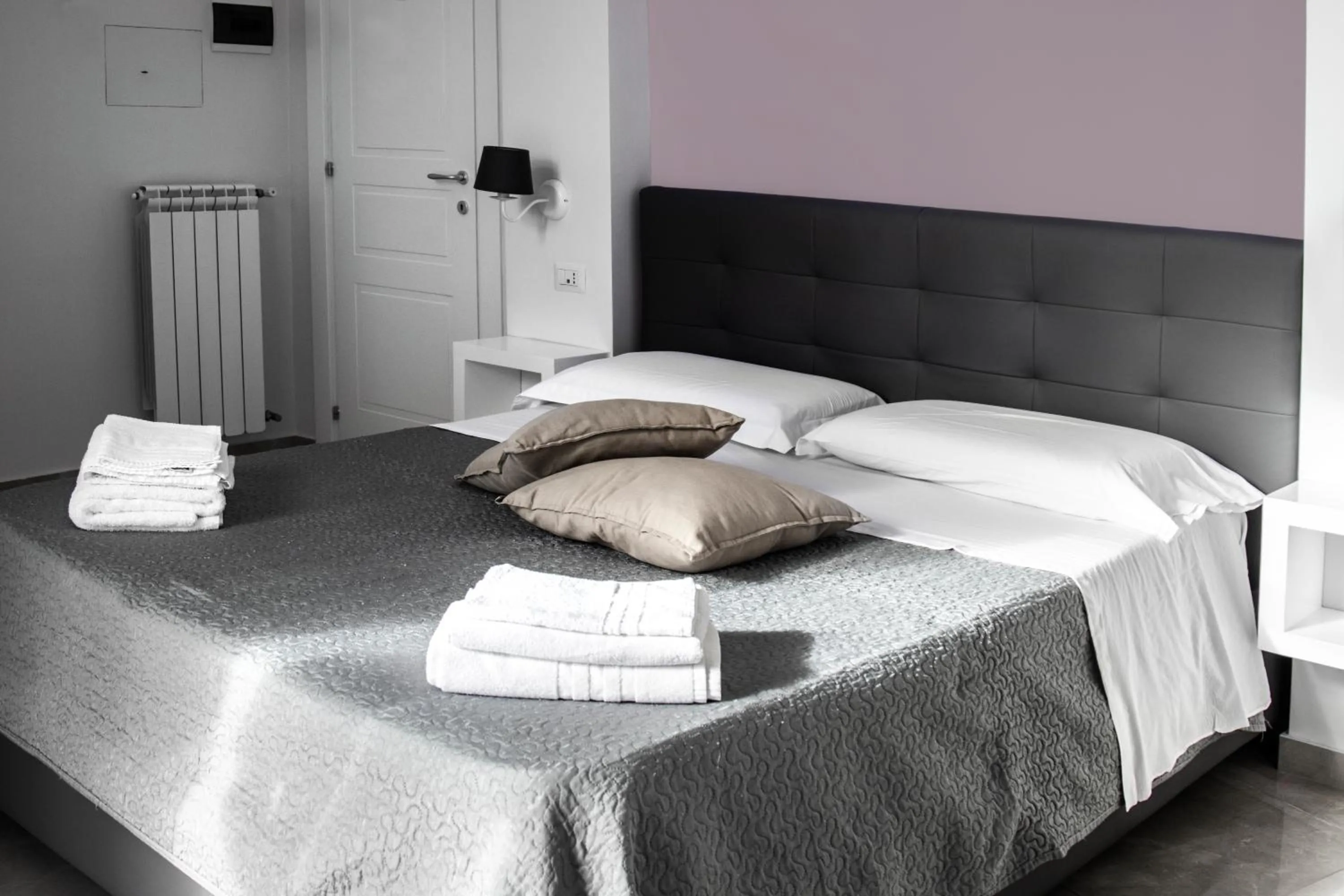 Bed in Aurora Luxury Rooms