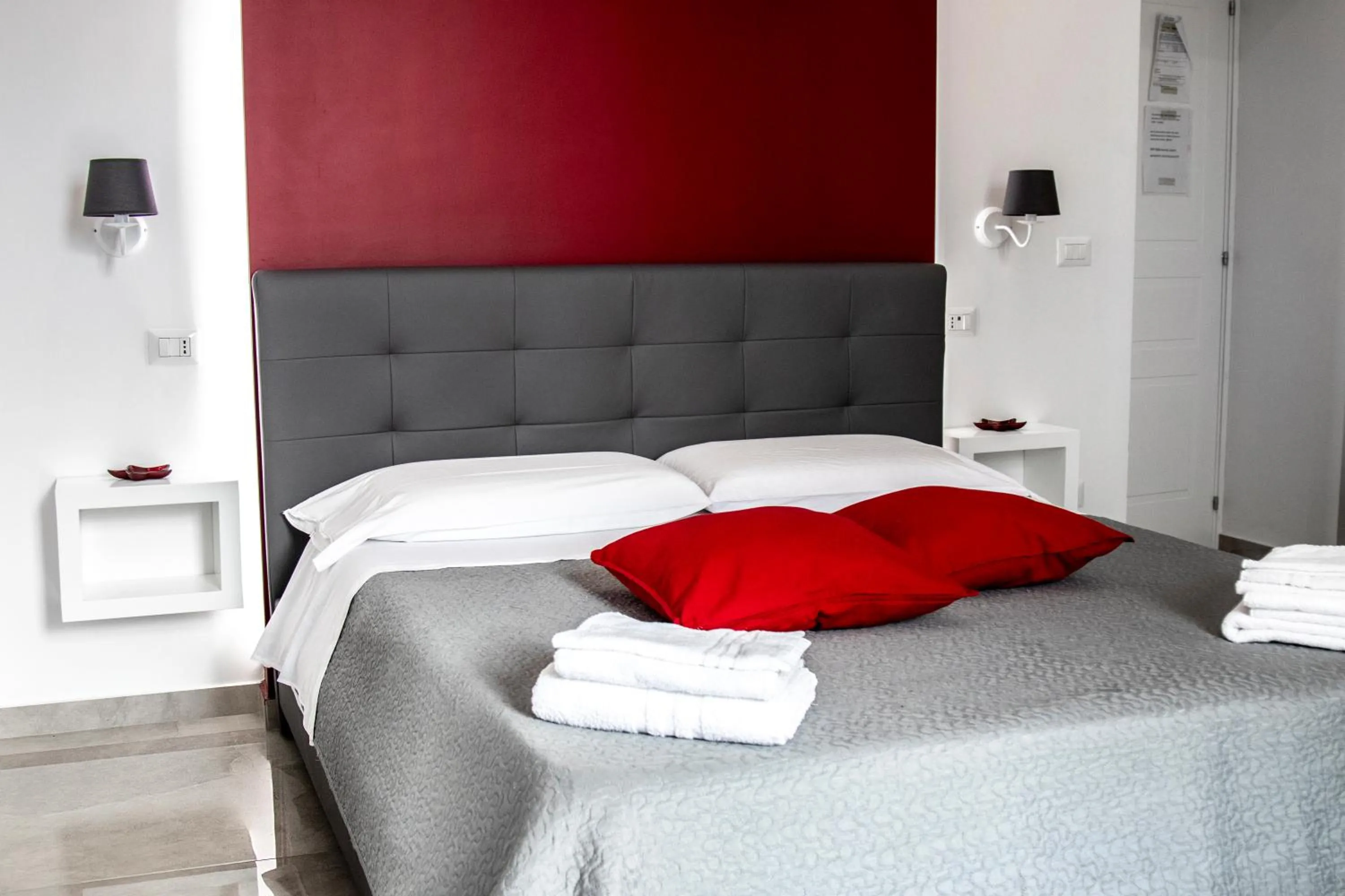 Bed in Aurora Luxury Rooms