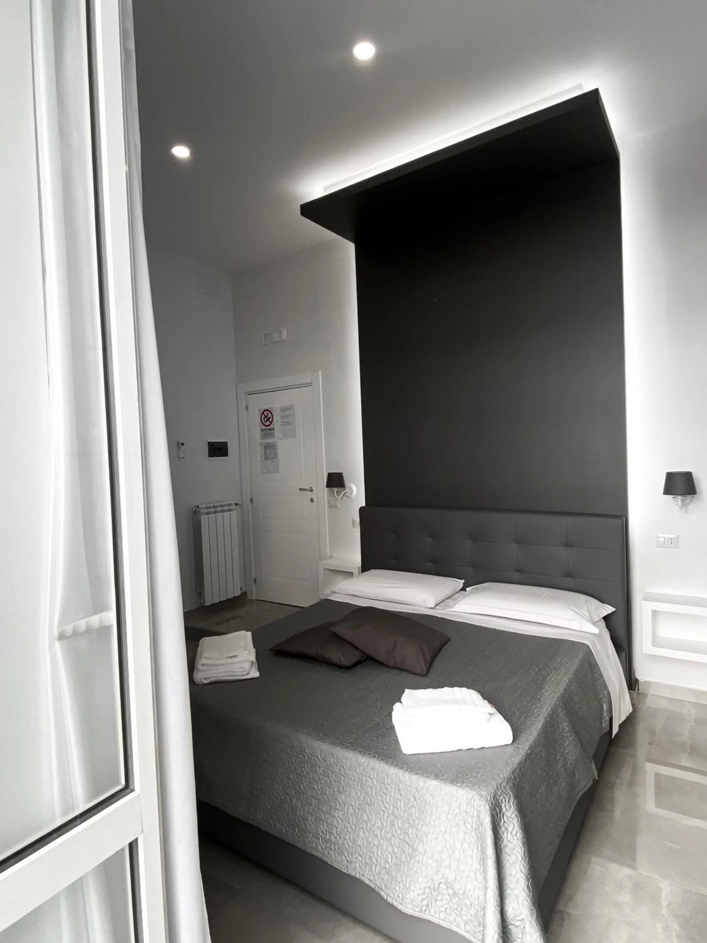 Bed in Aurora Luxury Rooms