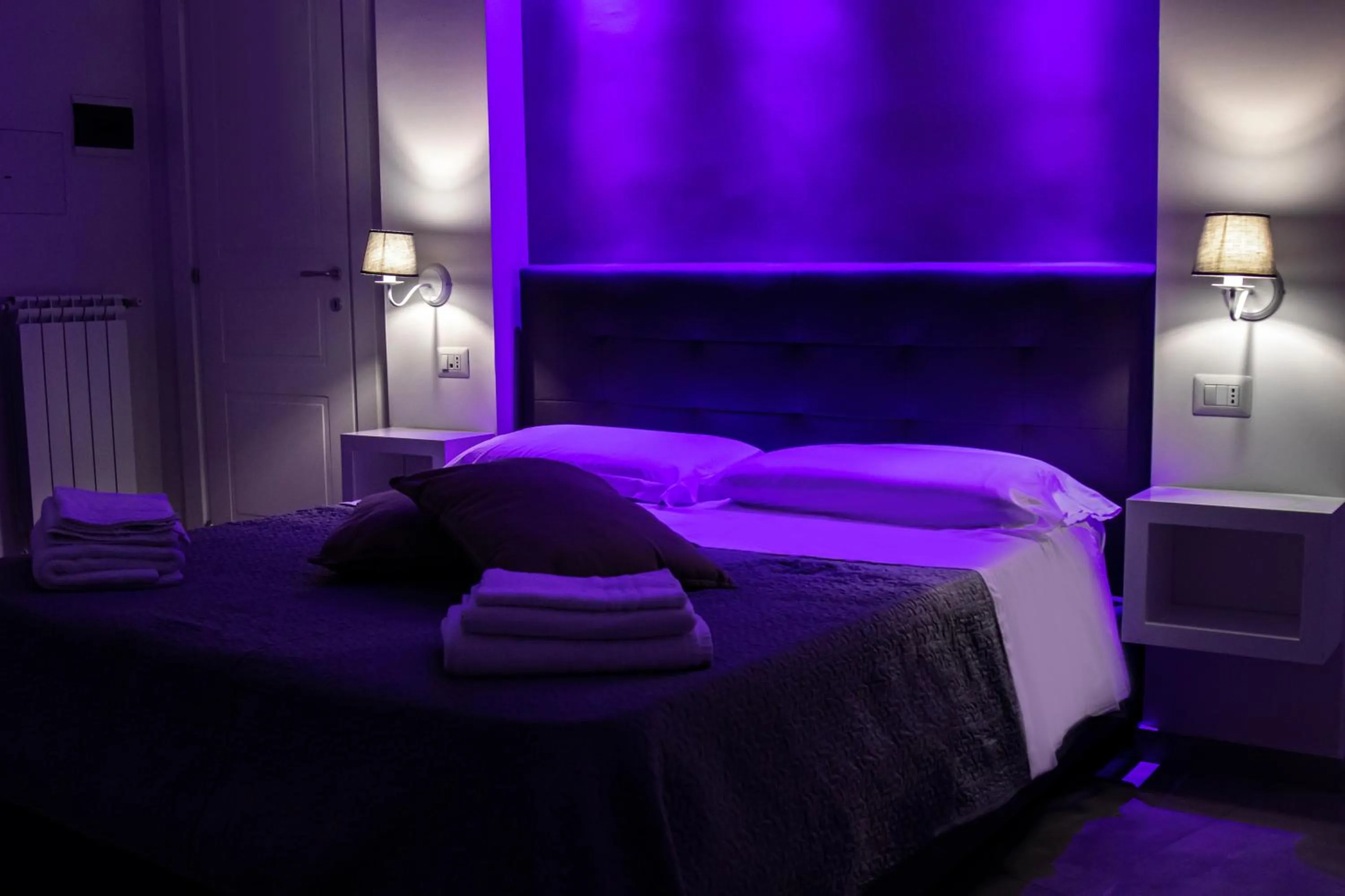 Bed in Aurora Luxury Rooms