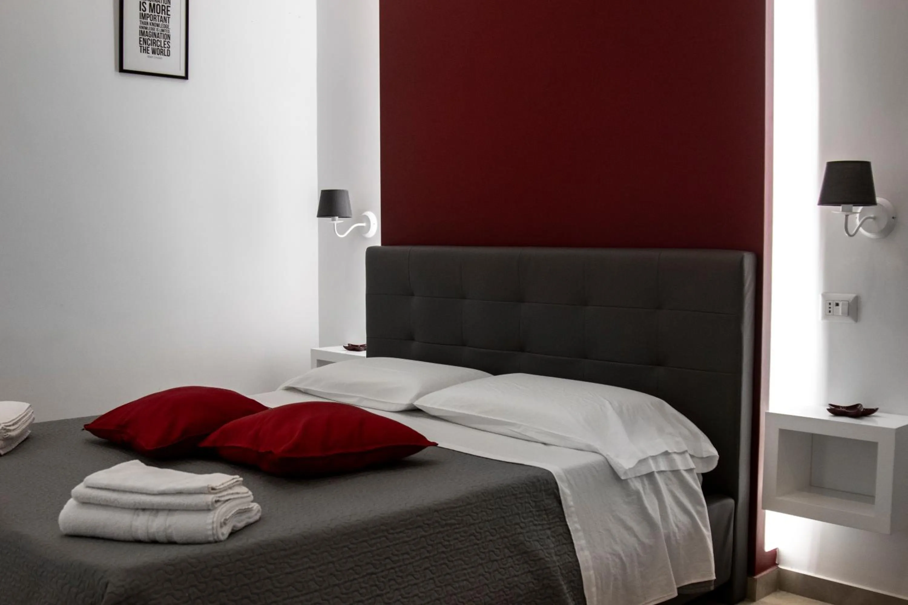 Bed in Aurora Luxury Rooms