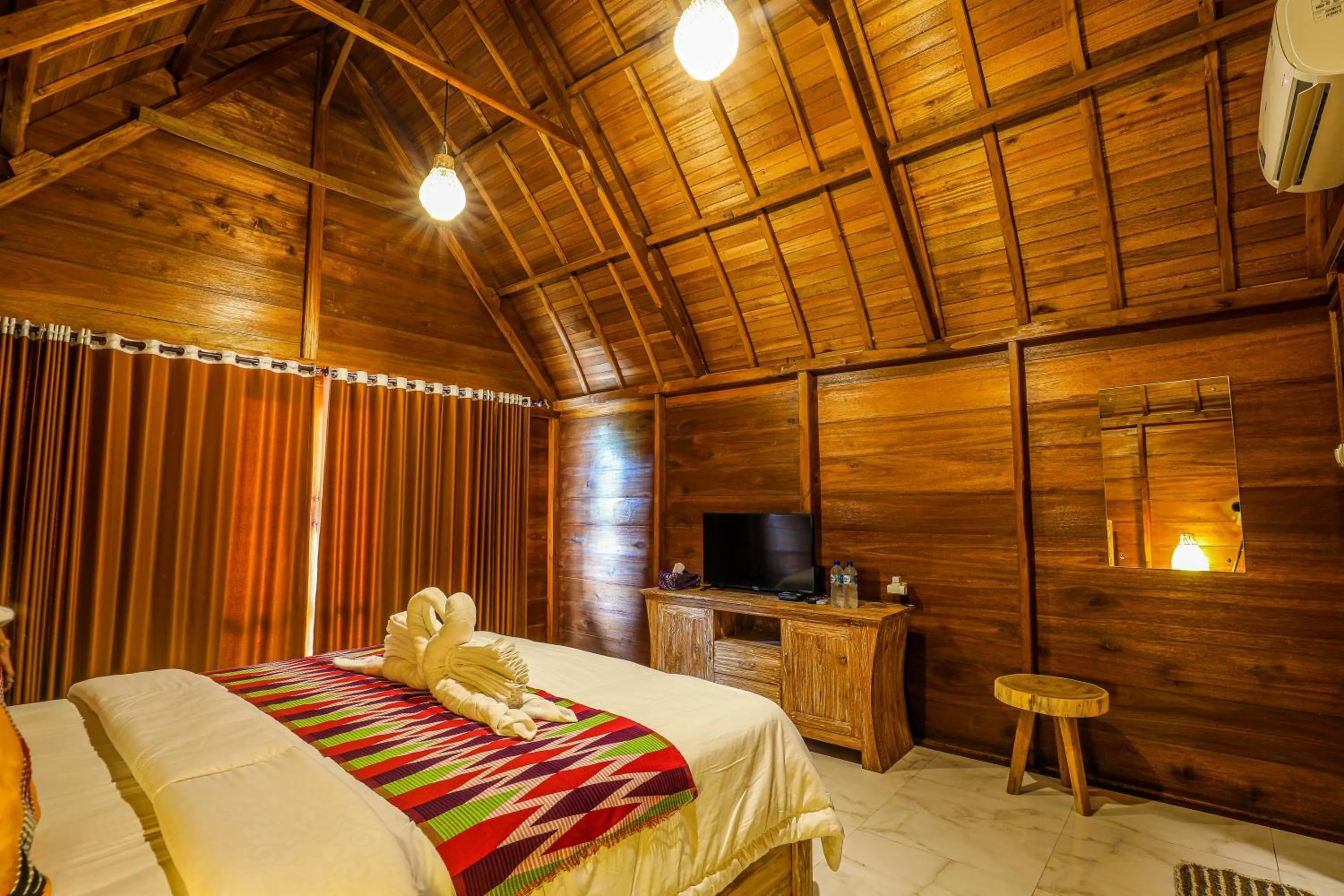 Bed in The Tukad Gepuh Cottage and Resto