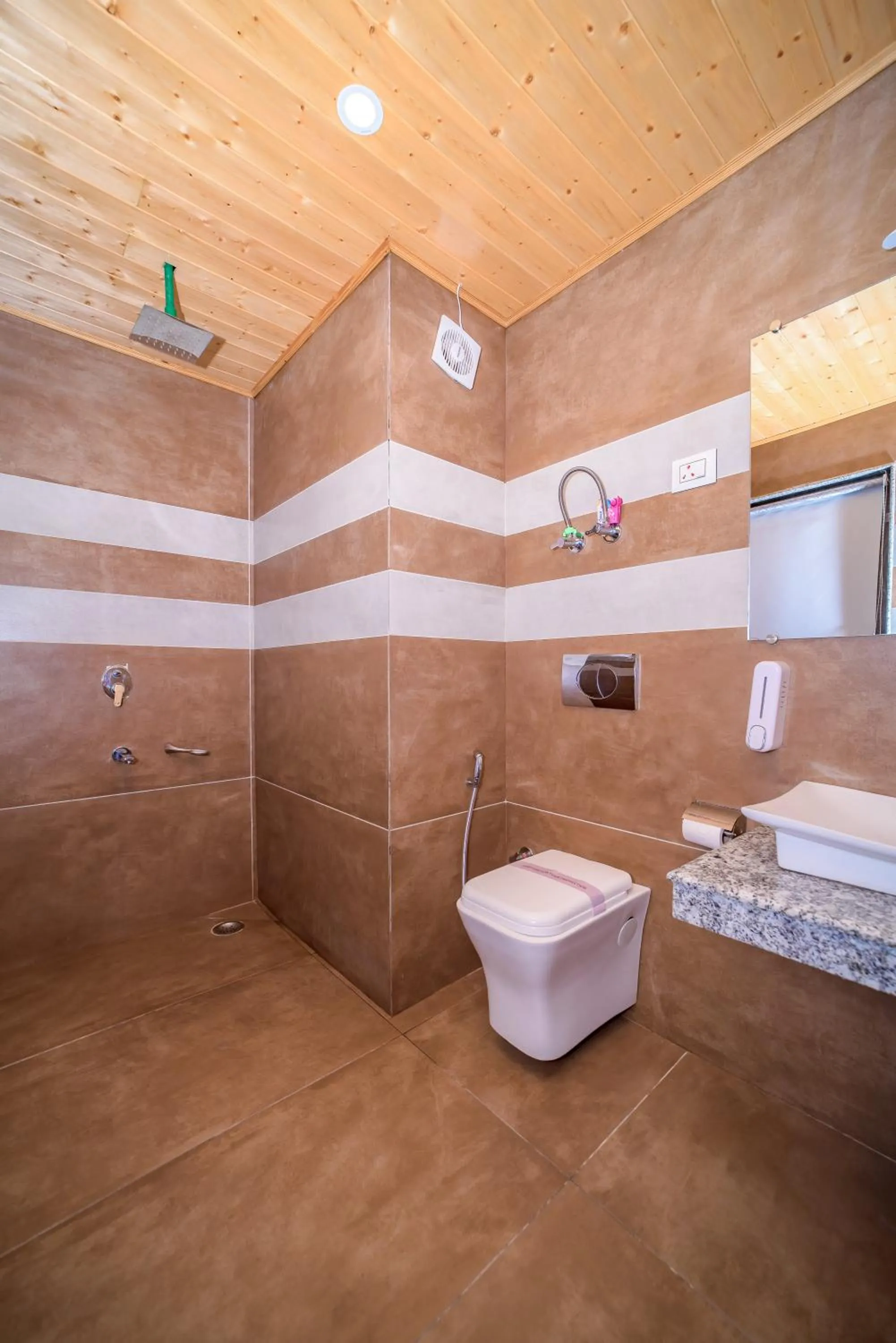 Shower in Snow City's Montana Blues Resort Manali - Heated & Air-Cooled Stay