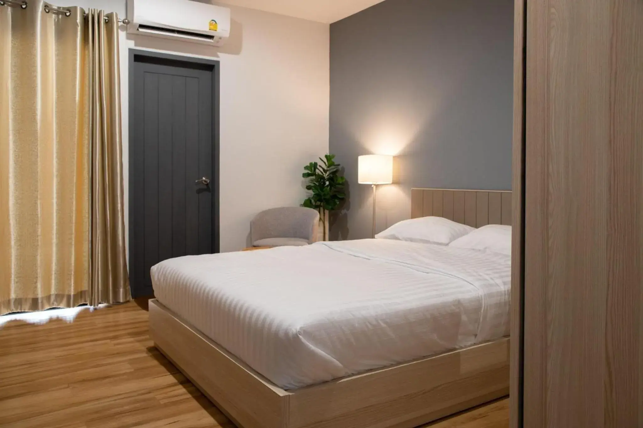 Bed in J & L Residence and Spa Bed in J & L Residence and Spa