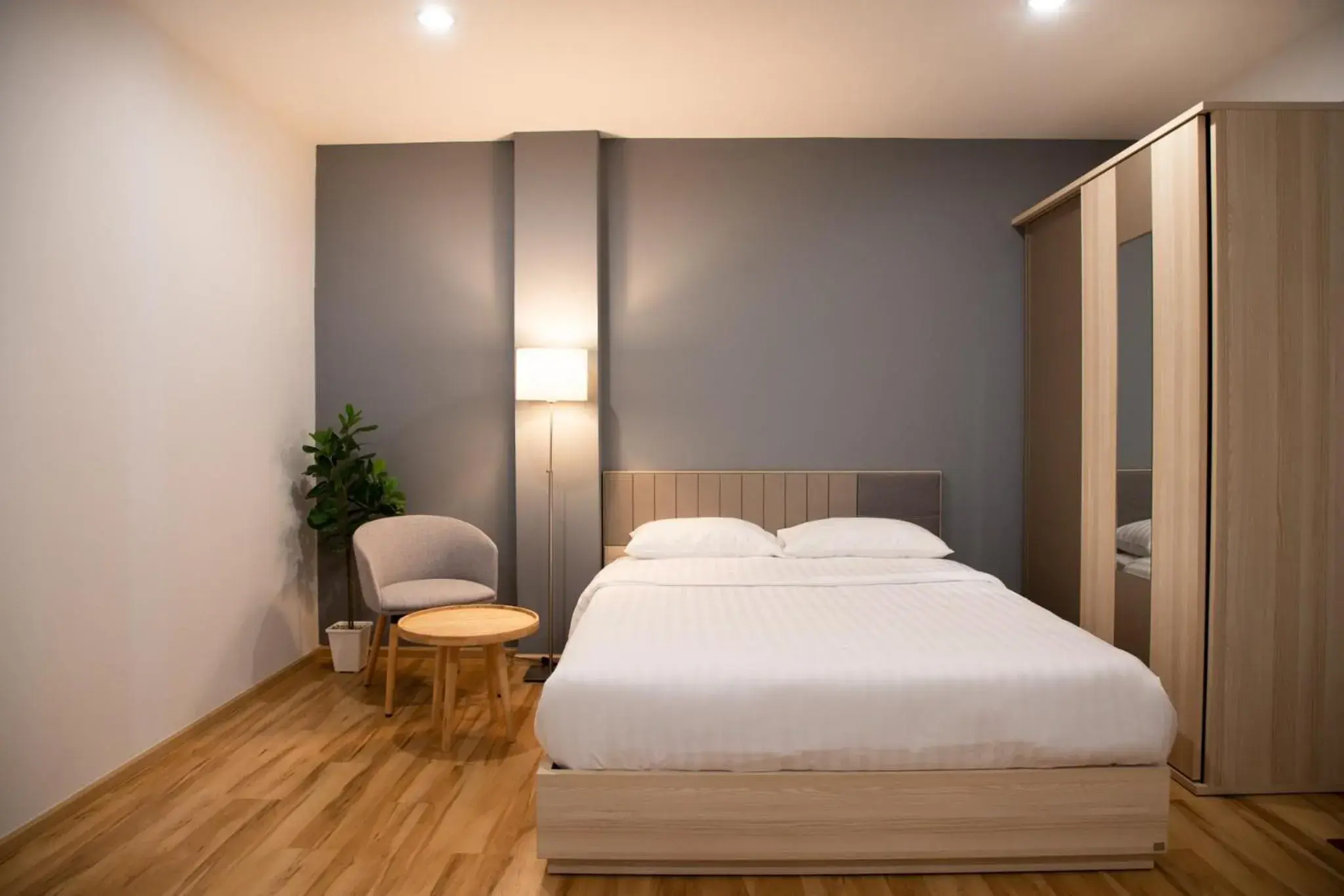 Bed in J & L Residence and Spa Bed in J & L Residence and Spa