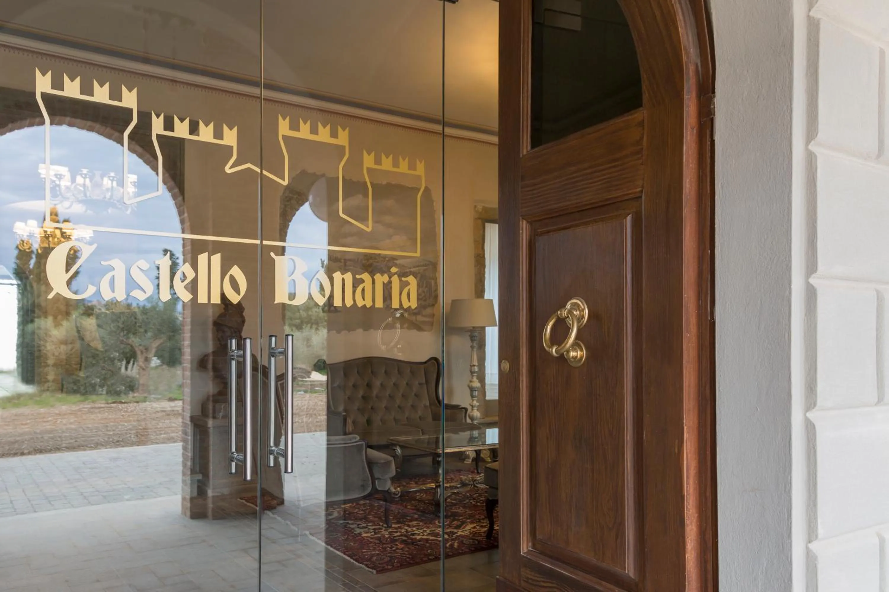 Property logo or sign in Castello Bonaria Wine & Spa Resort