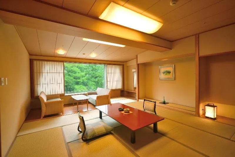 Bed in Hotel New Mitoya