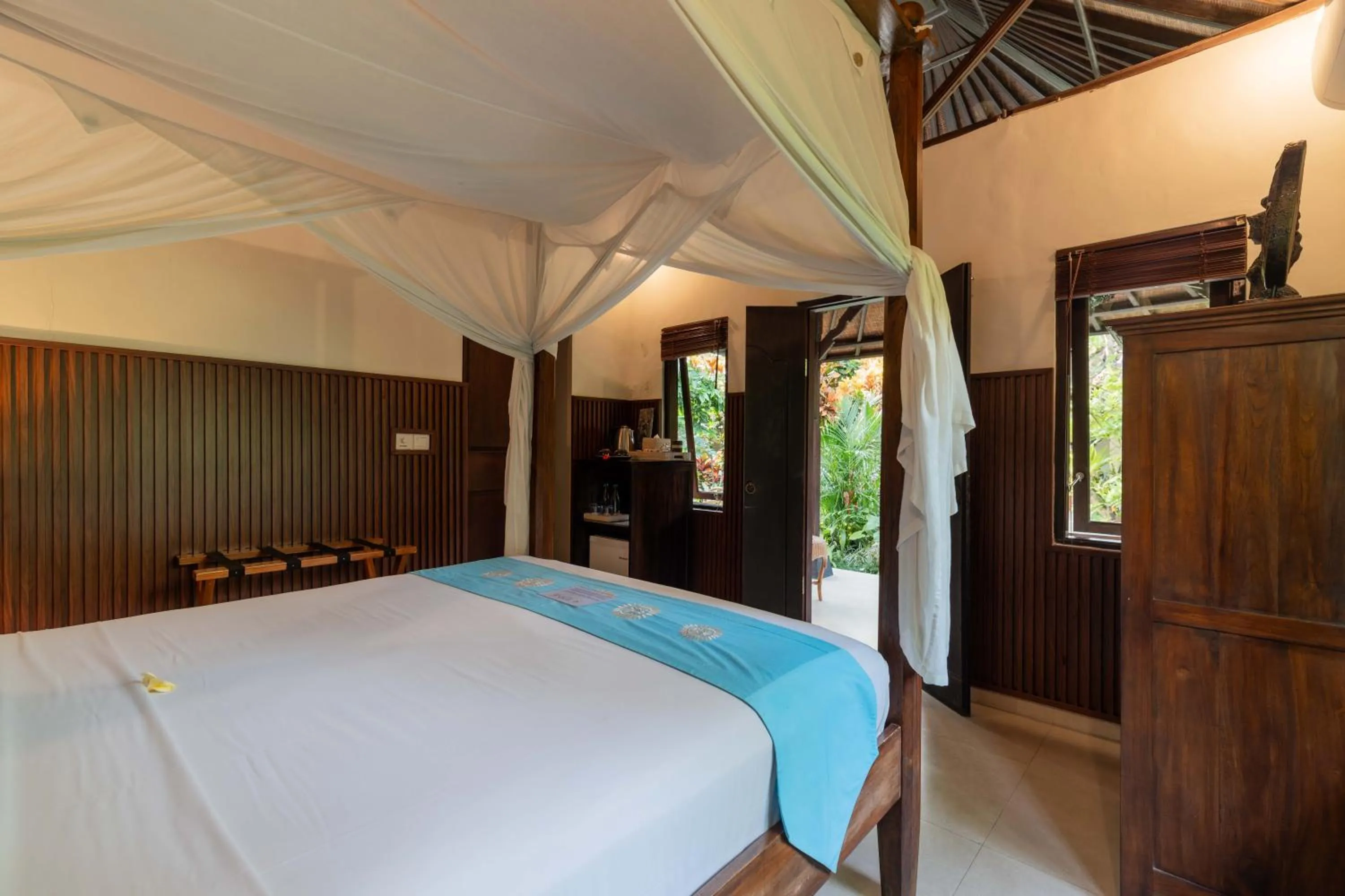 Bed in Sama's Cottages and Villas