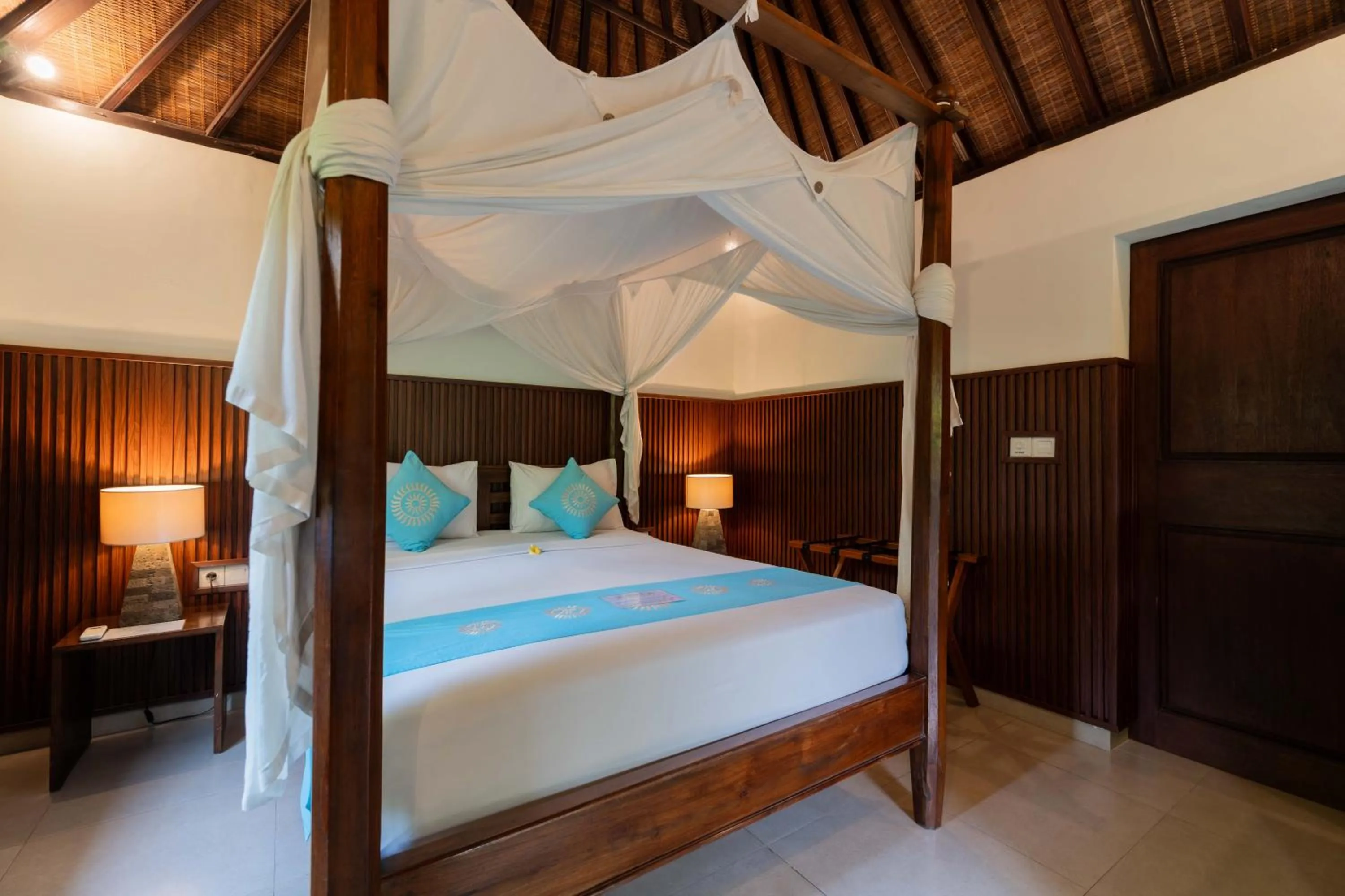 Bed in Sama's Cottages and Villas