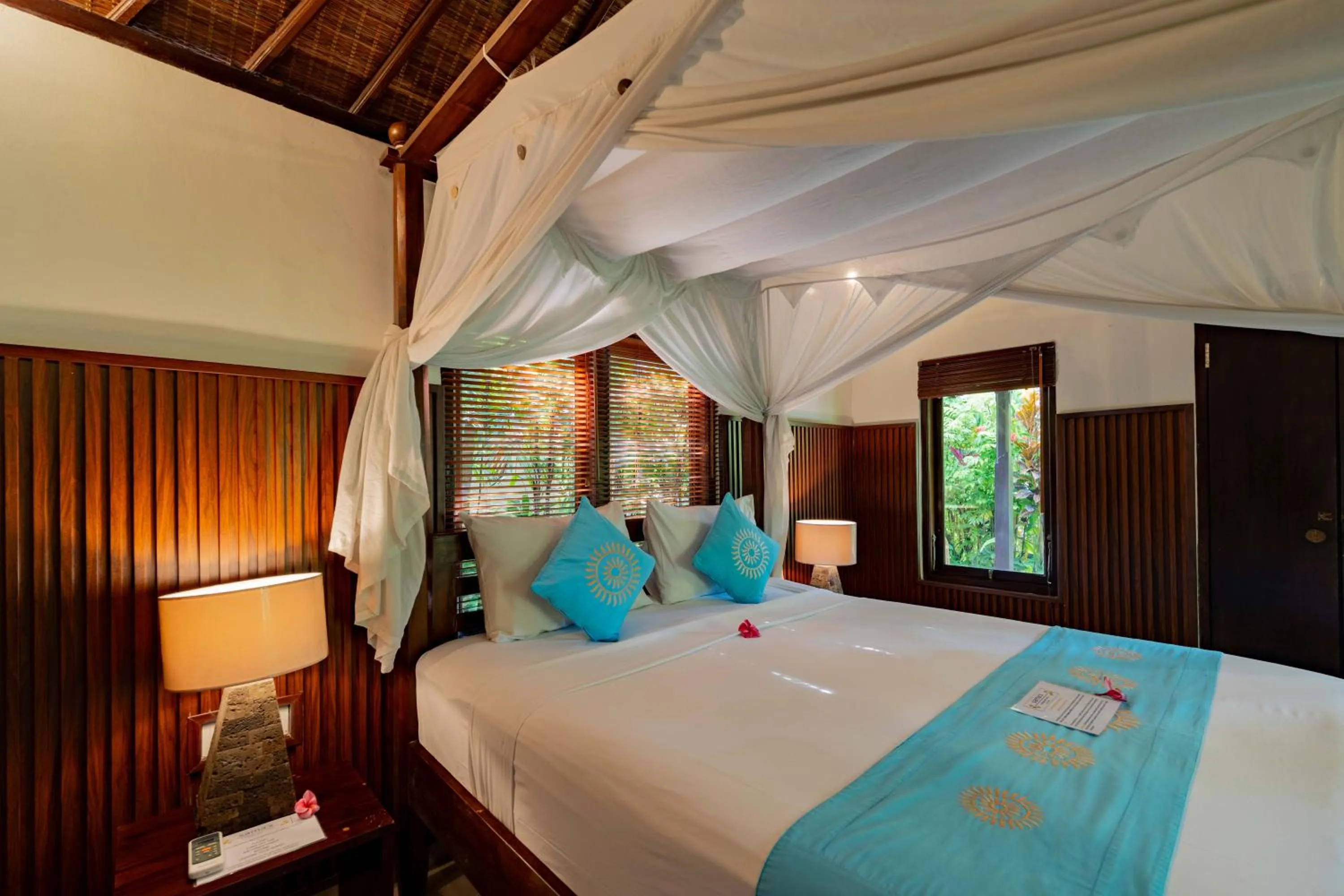 Bed in Sama's Cottages and Villas