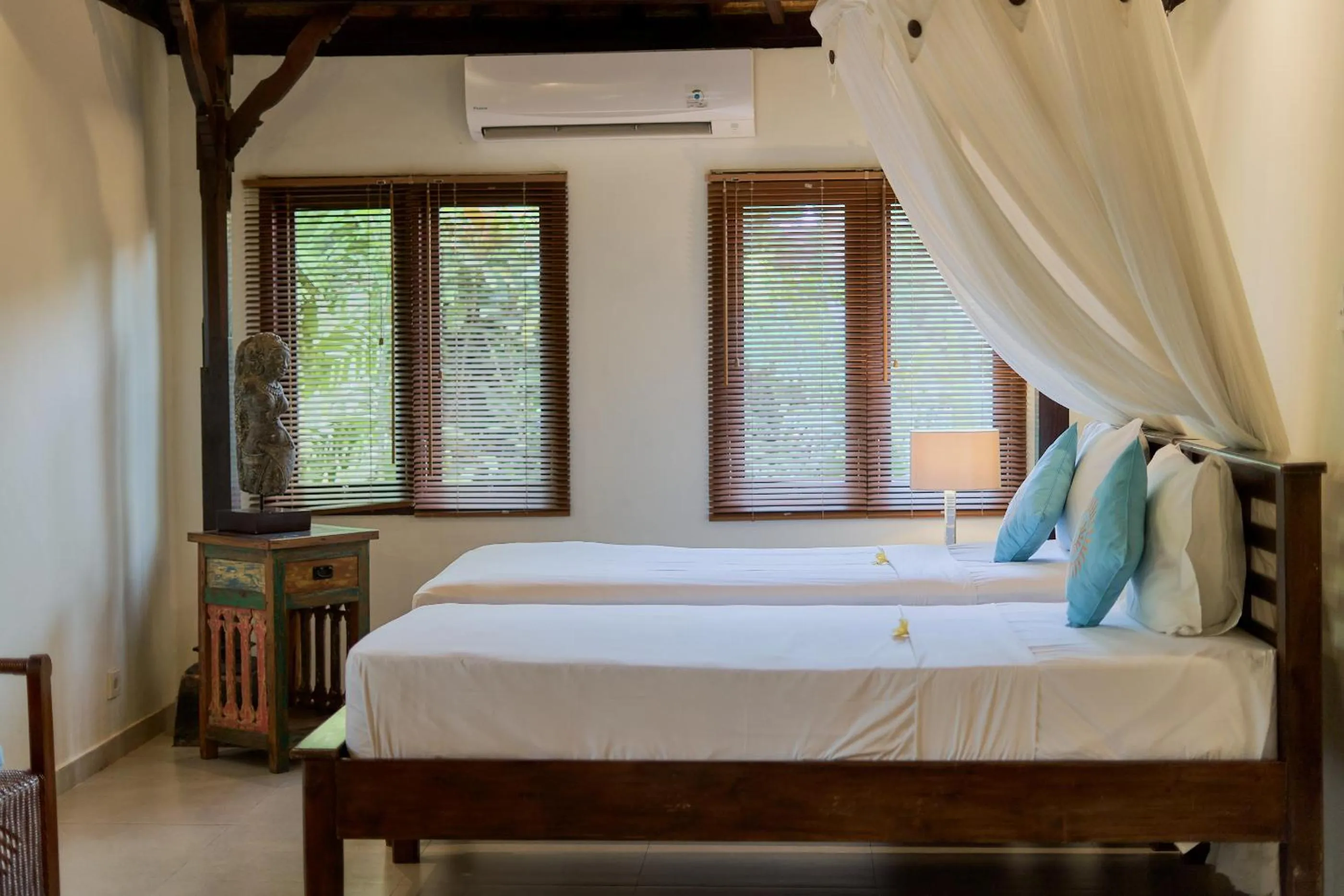 Bed in Sama's Cottages and Villas