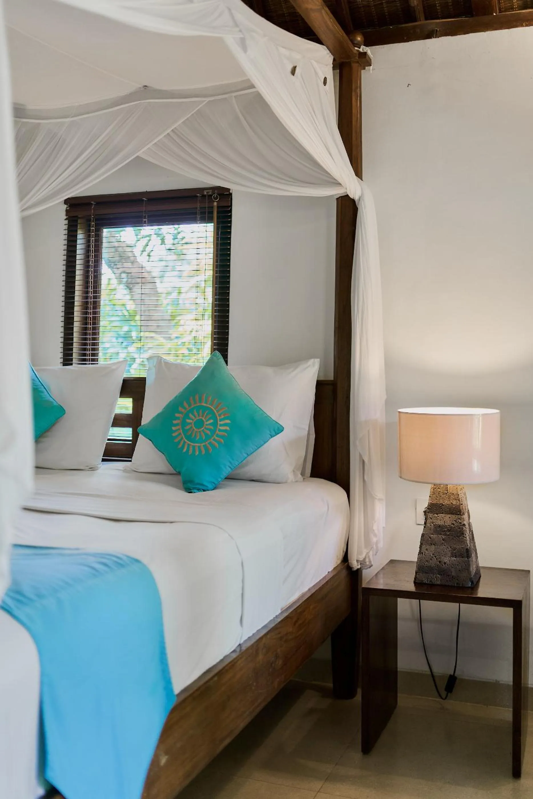 Bed in Sama's Cottages and Villas