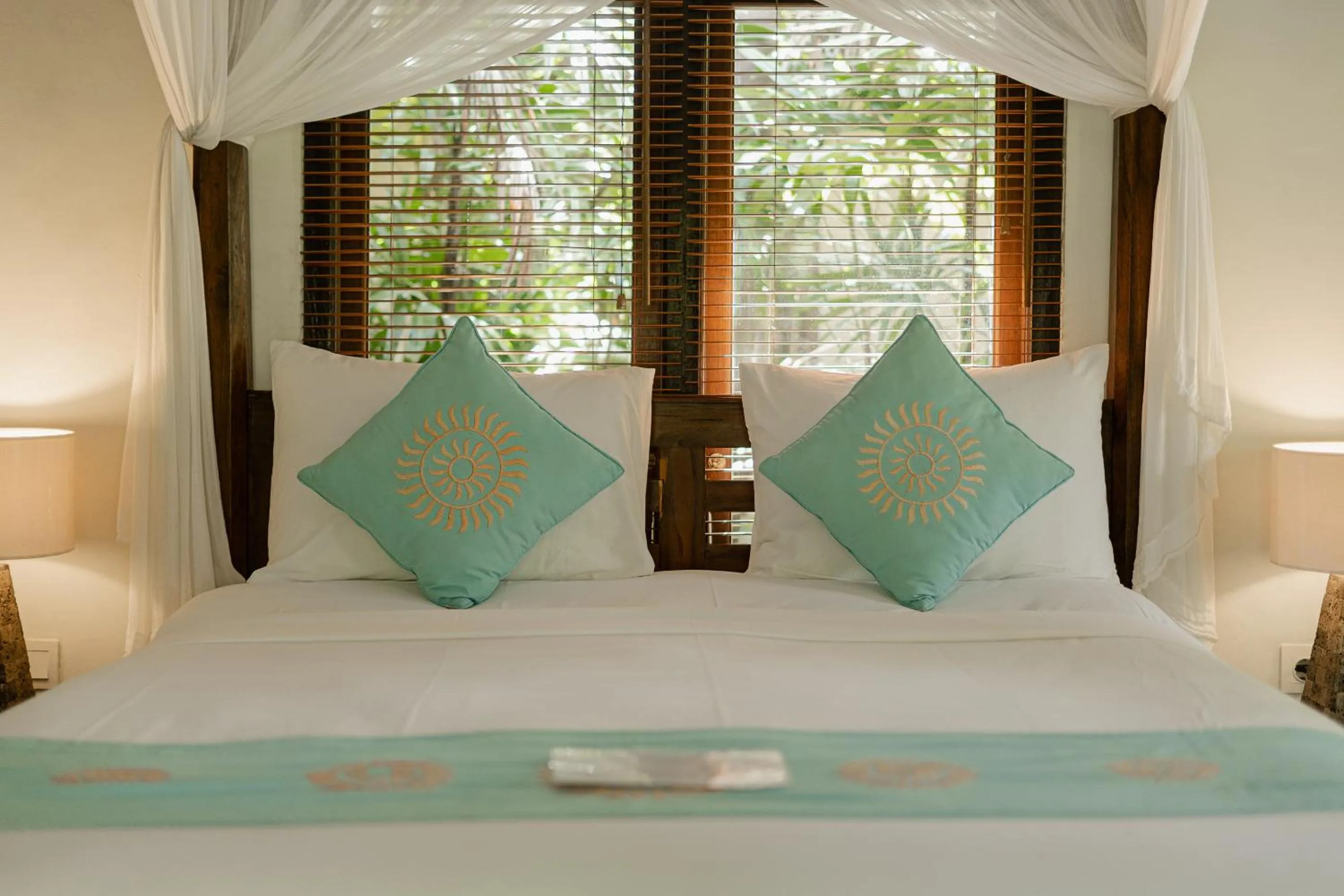 Bed in Sama's Cottages and Villas