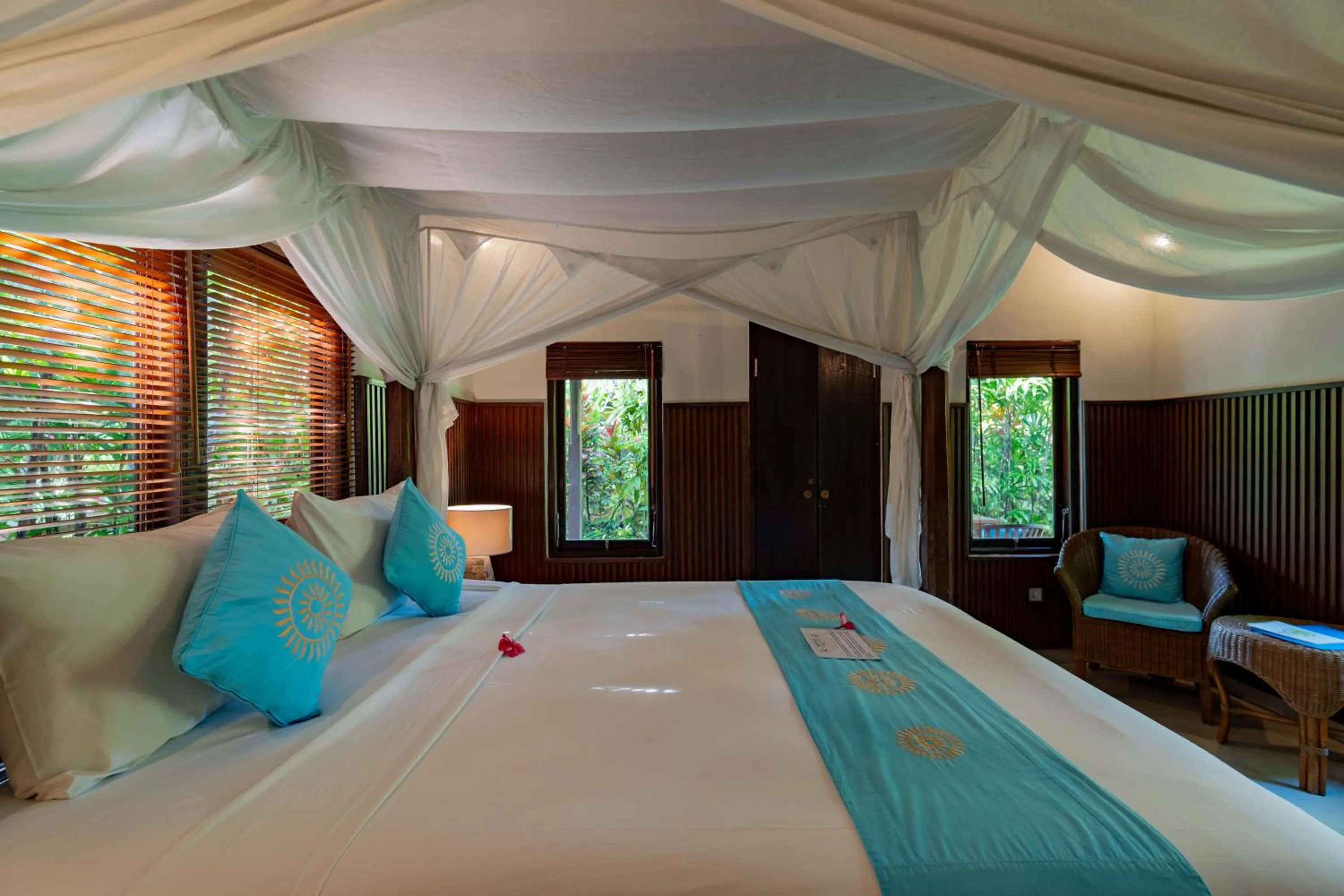 Bed in Sama's Cottages and Villas