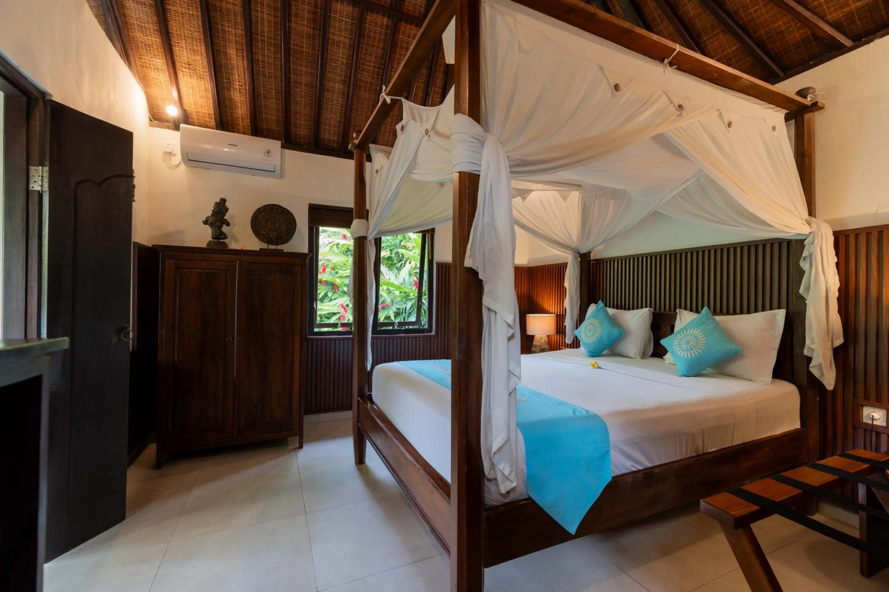 Bed in Sama's Cottages and Villas