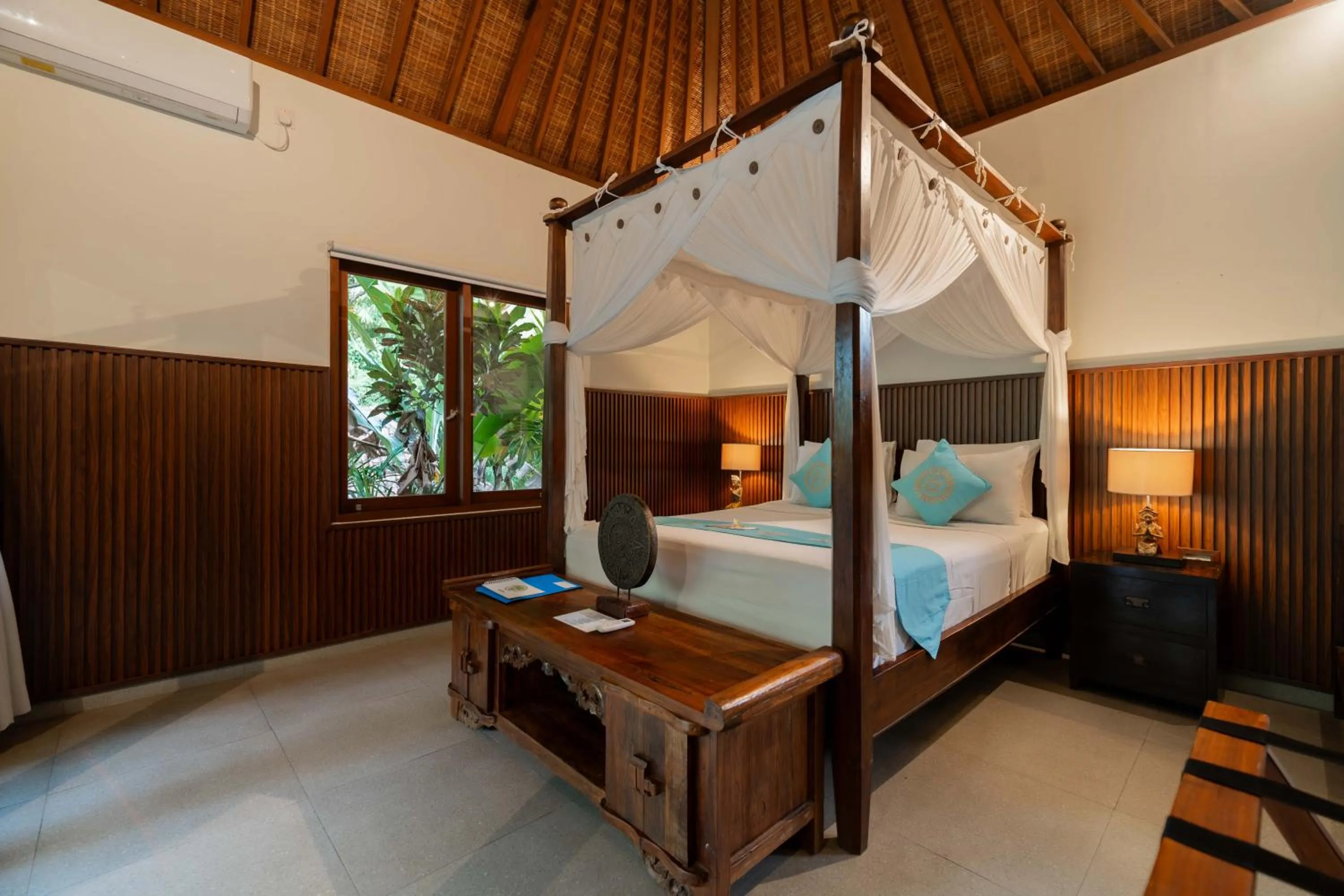 Bed in Sama's Cottages and Villas