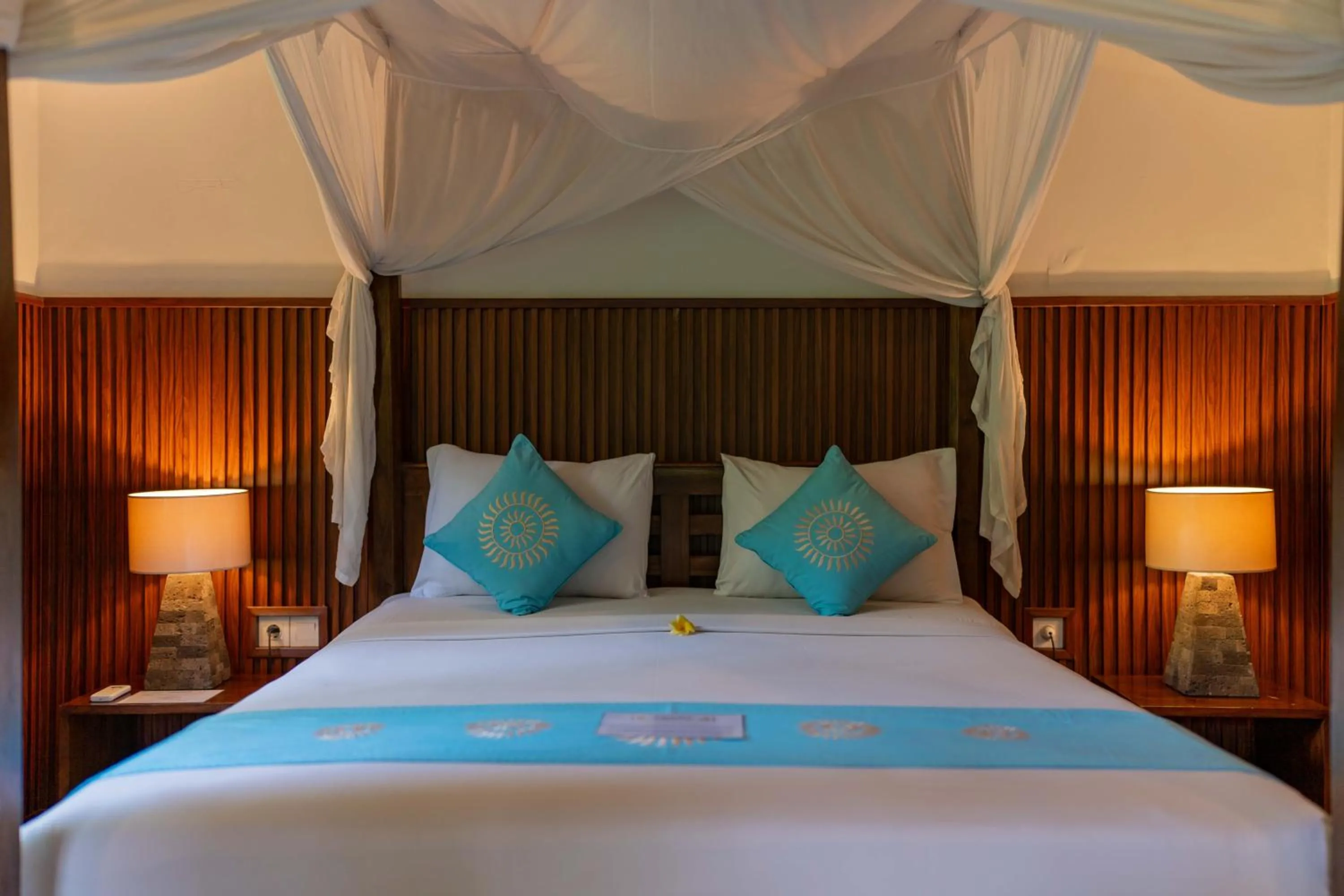 Bed in Sama's Cottages and Villas