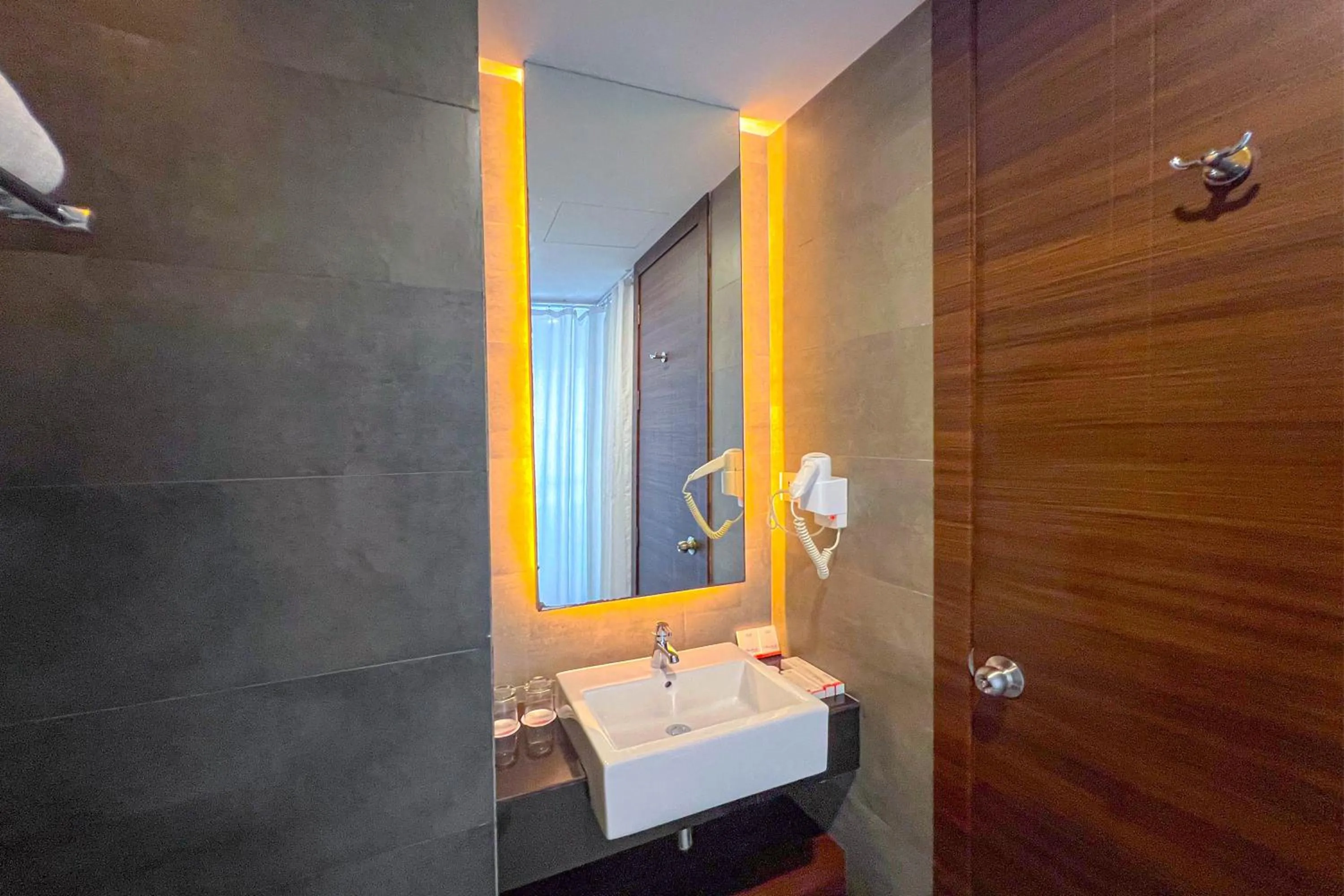 Bathroom in Asialink Hotel Batam by Prasanthi