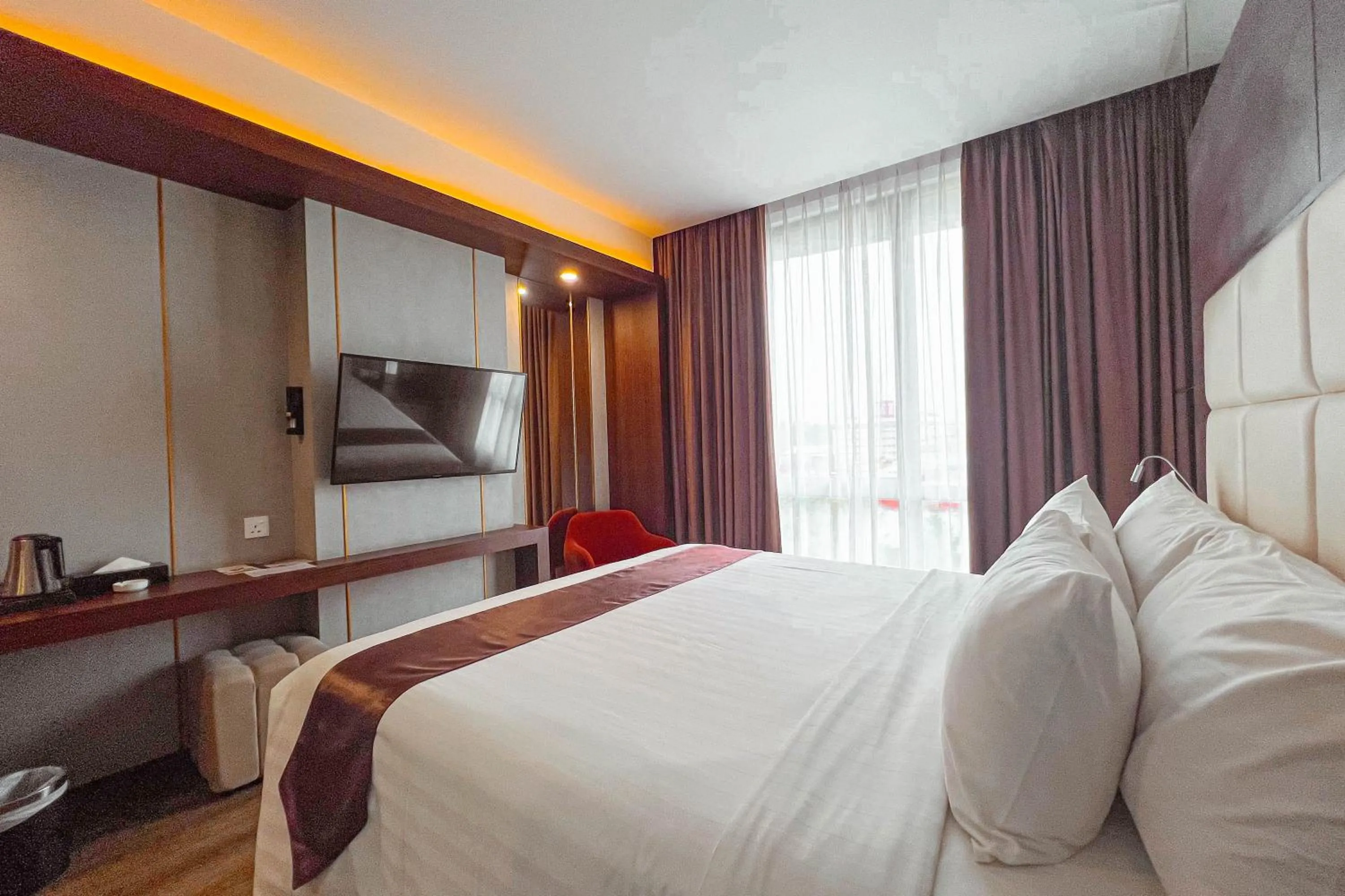 Bed in Asialink Hotel Batam by Prasanthi