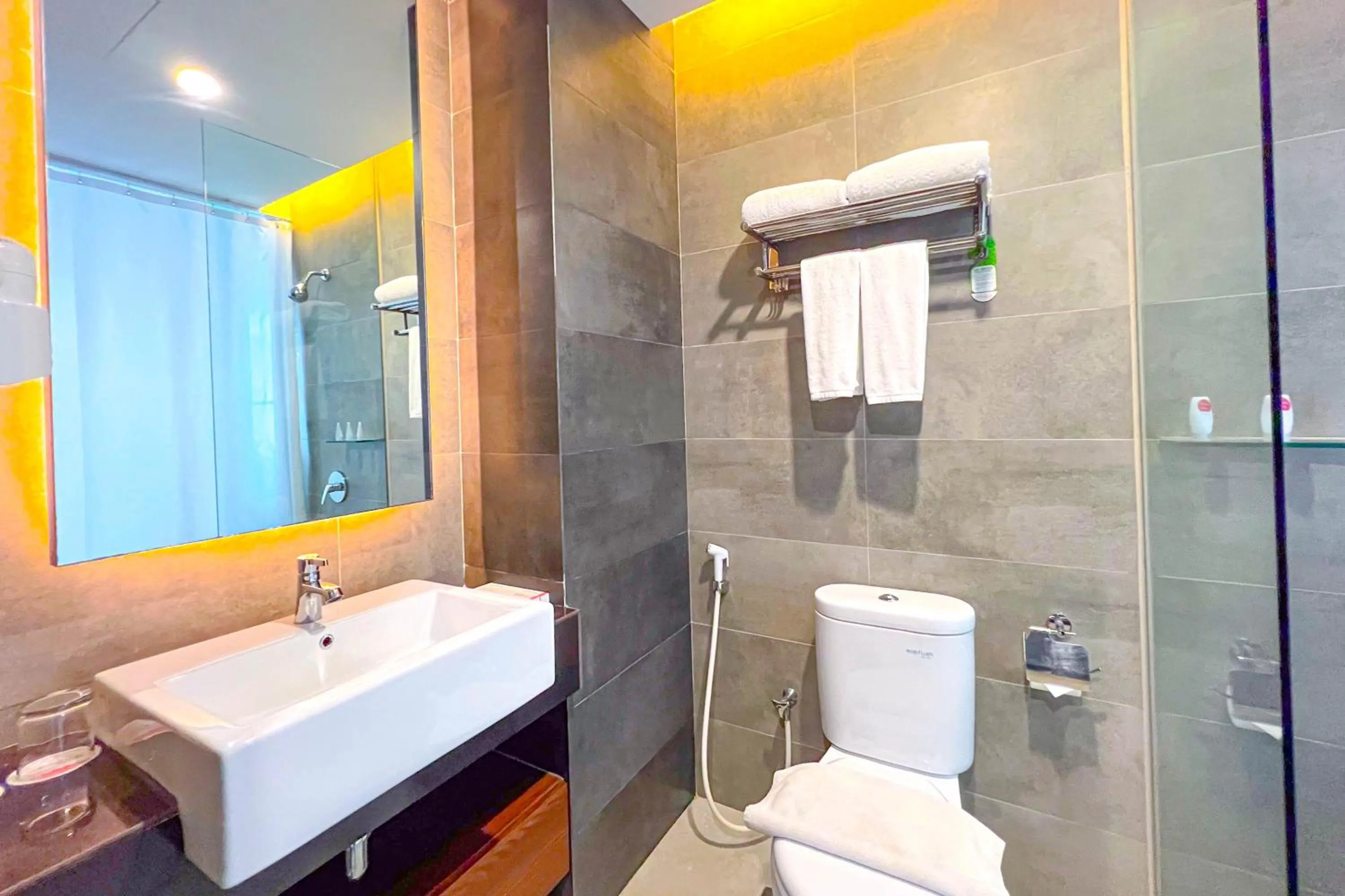 Bathroom in Asialink Hotel Batam by Prasanthi