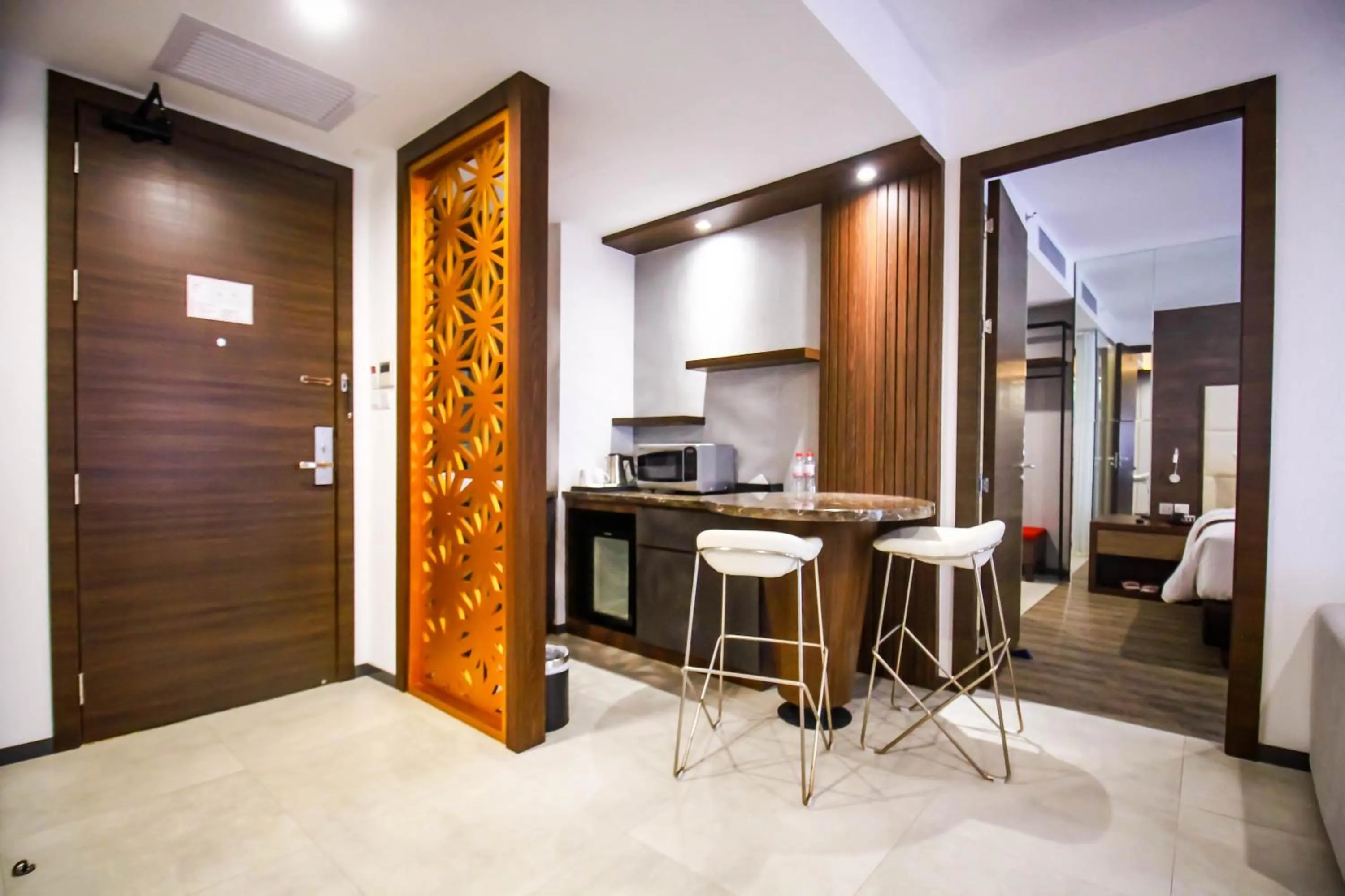 Living room in Asialink Hotel Batam by Prasanthi