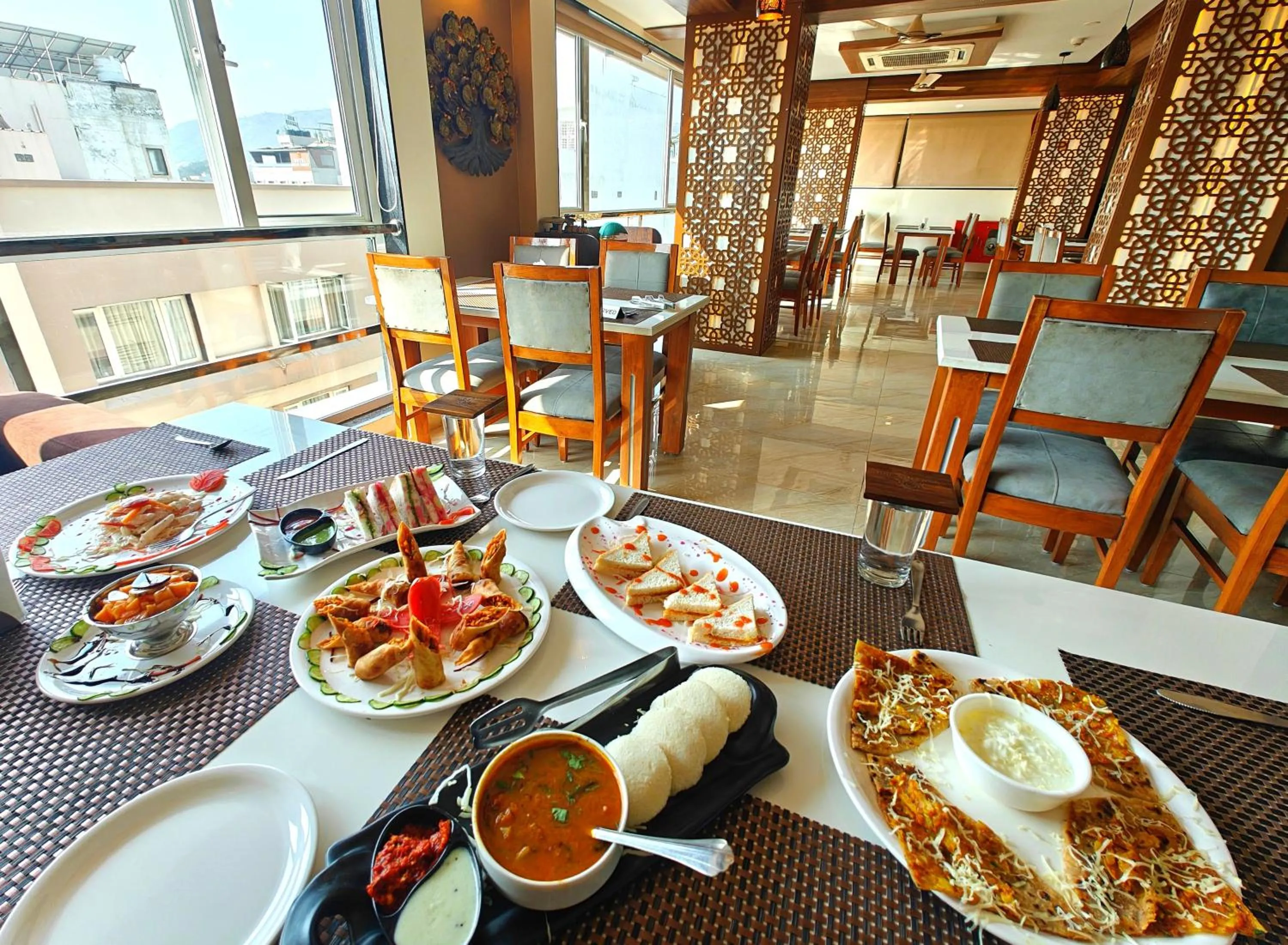 Restaurant/places to eat in Opulence Inn - 500 Meters From Railway Station