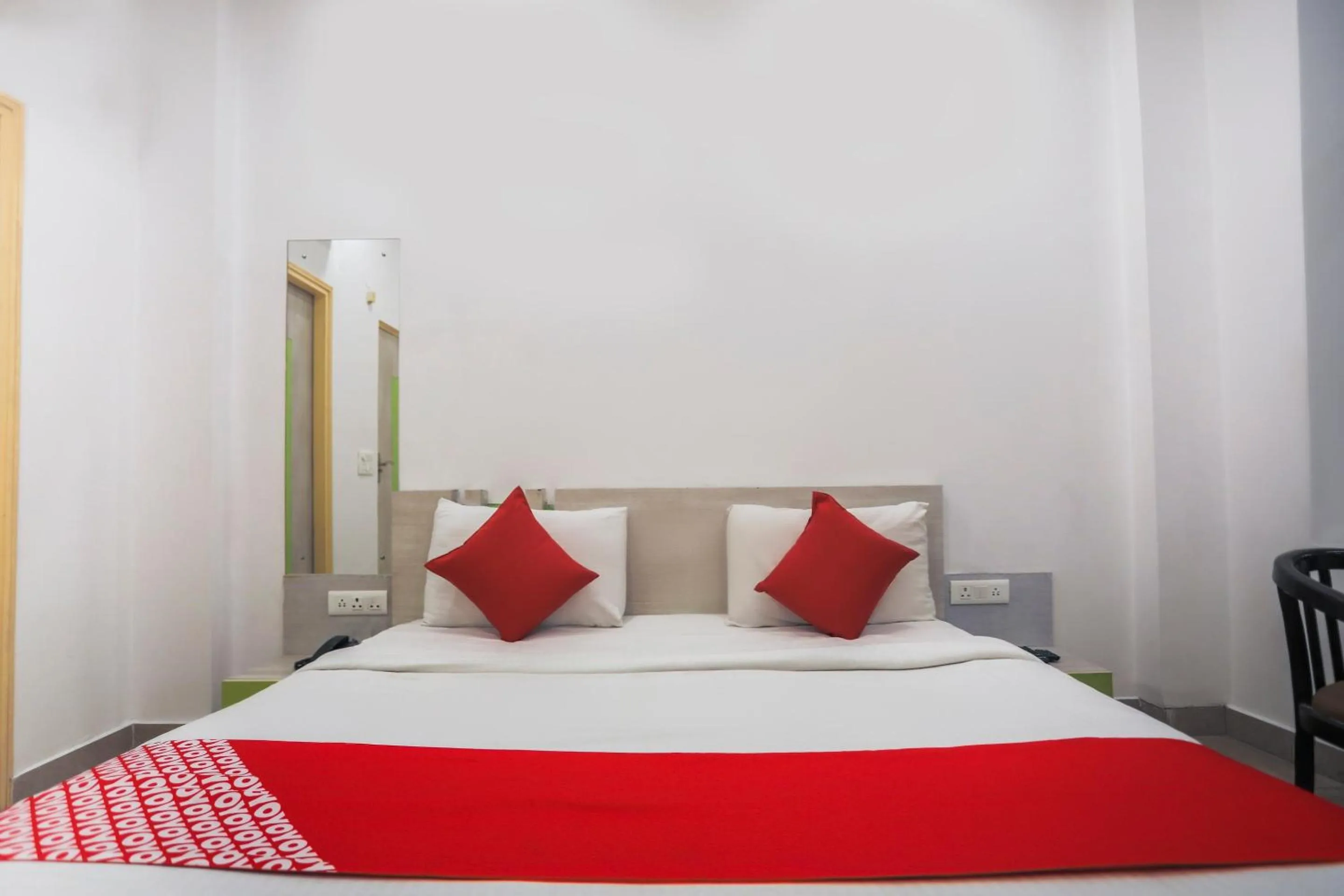 Bedroom in OYO Cladis Near Mall Of India