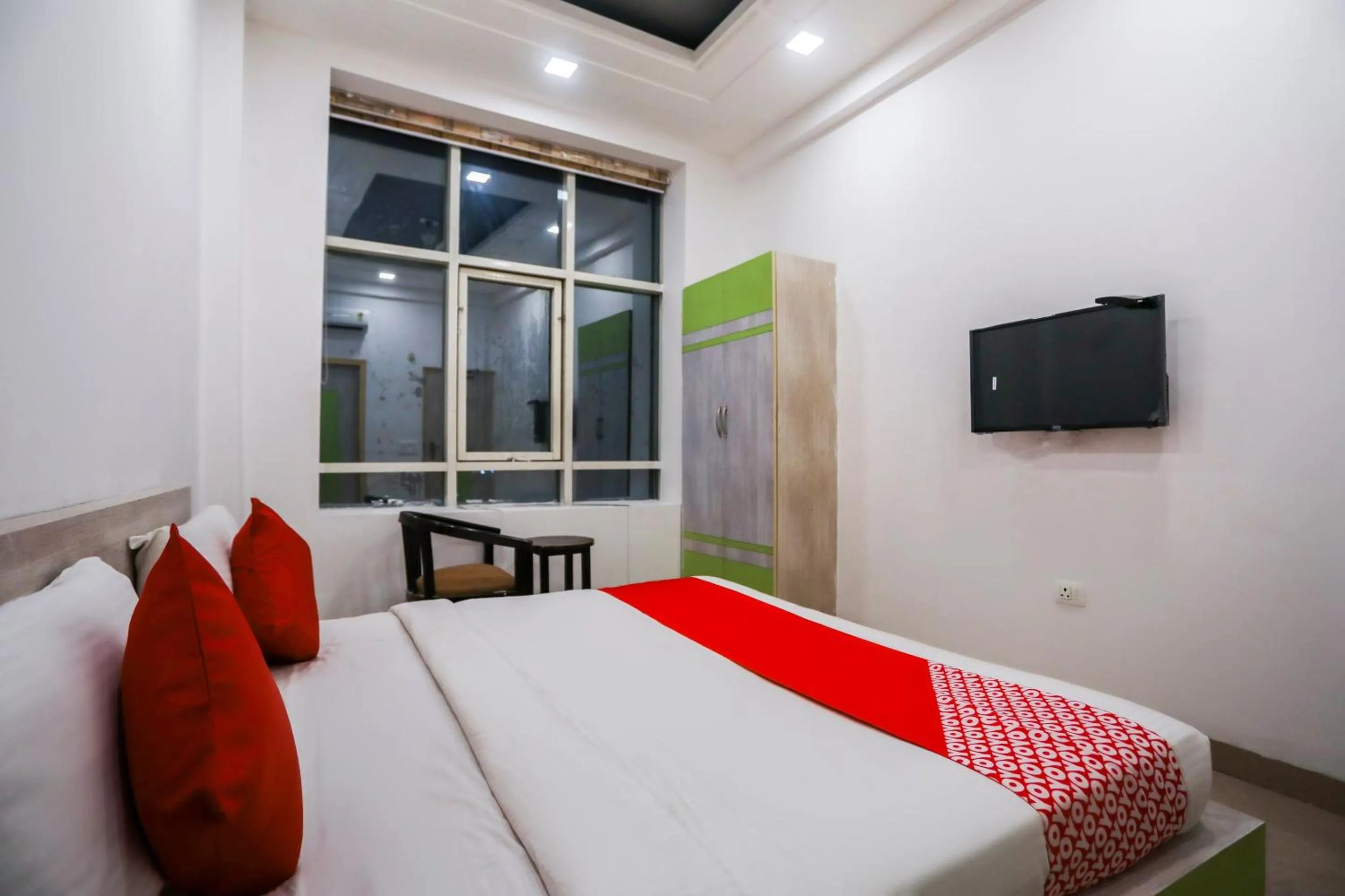 Bedroom in OYO Cladis Near Mall Of India