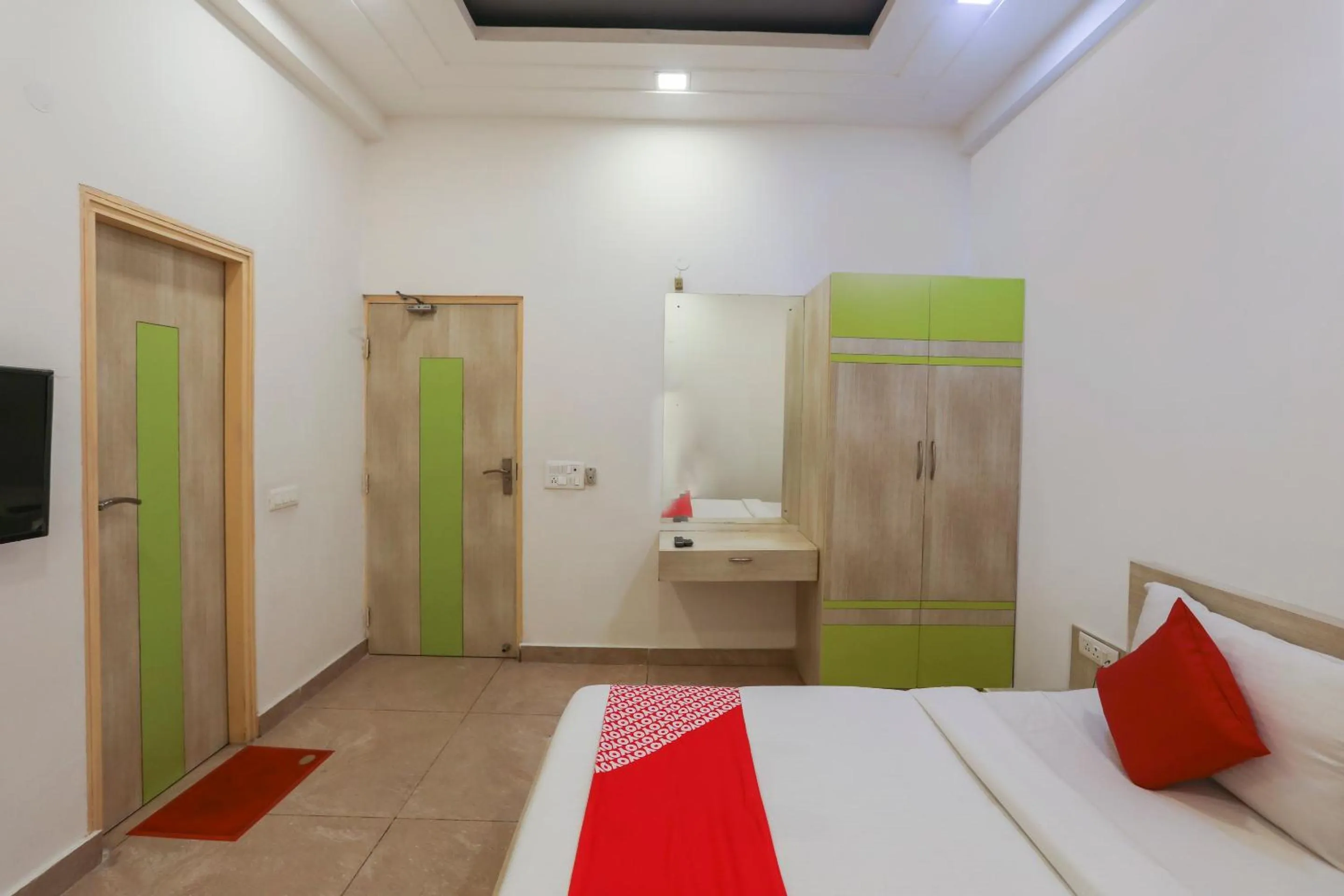 Bedroom in OYO Cladis Near Mall Of India