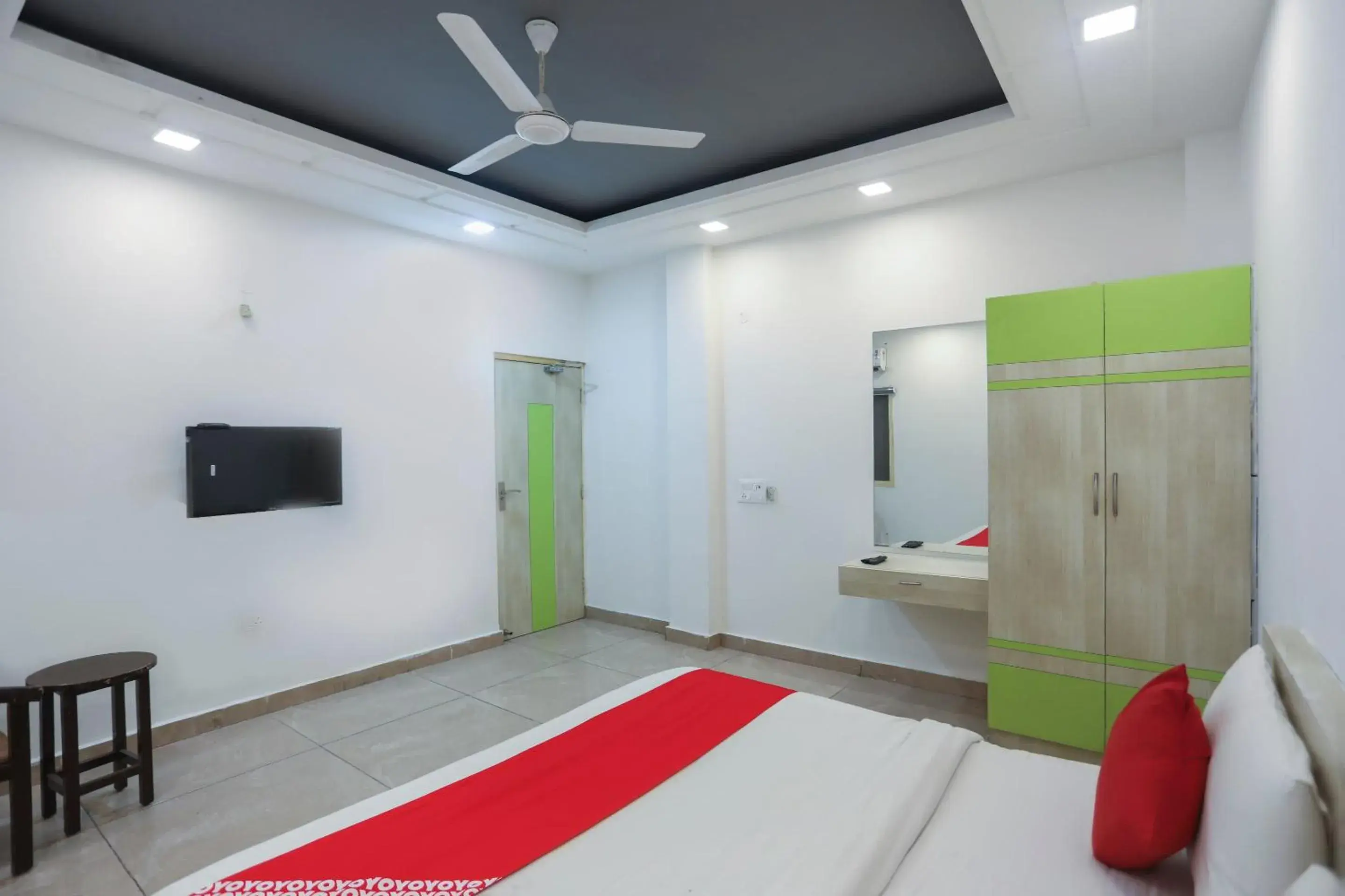 Bedroom, TV/Entertainment Center in OYO Cladis Near Mall Of India