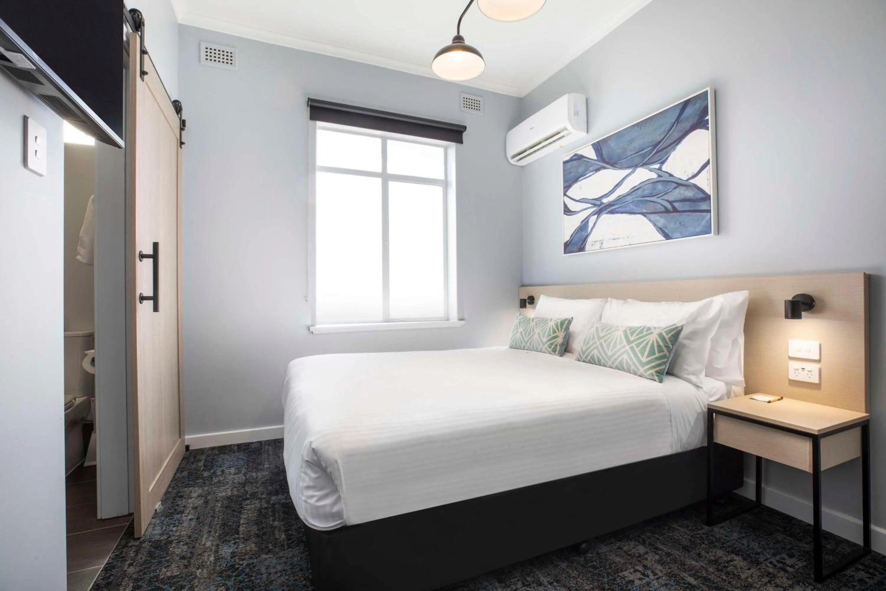 Bedroom, Bed in Nightcap at Rex Hotel