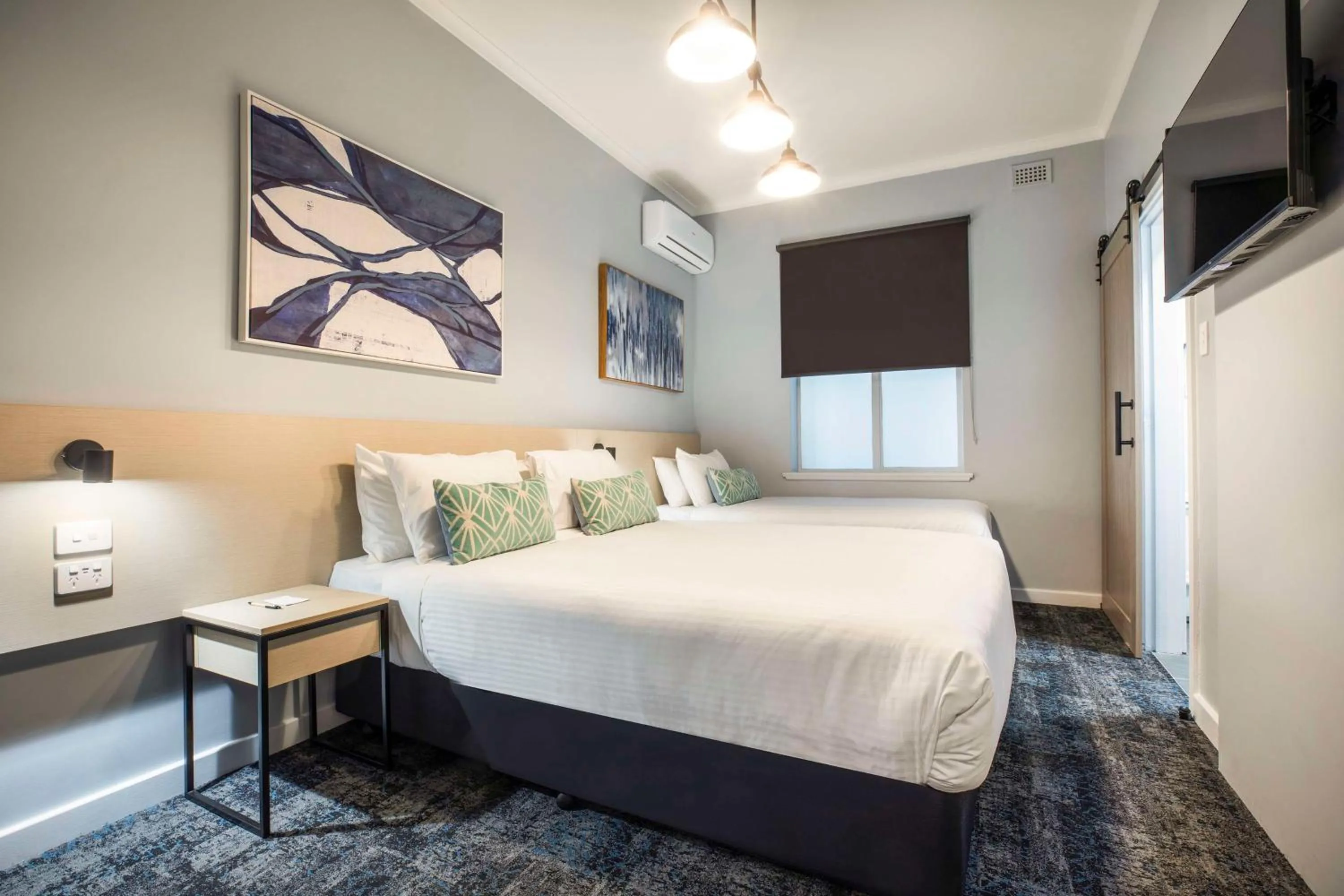 Bedroom, Bed in Nightcap at Rex Hotel