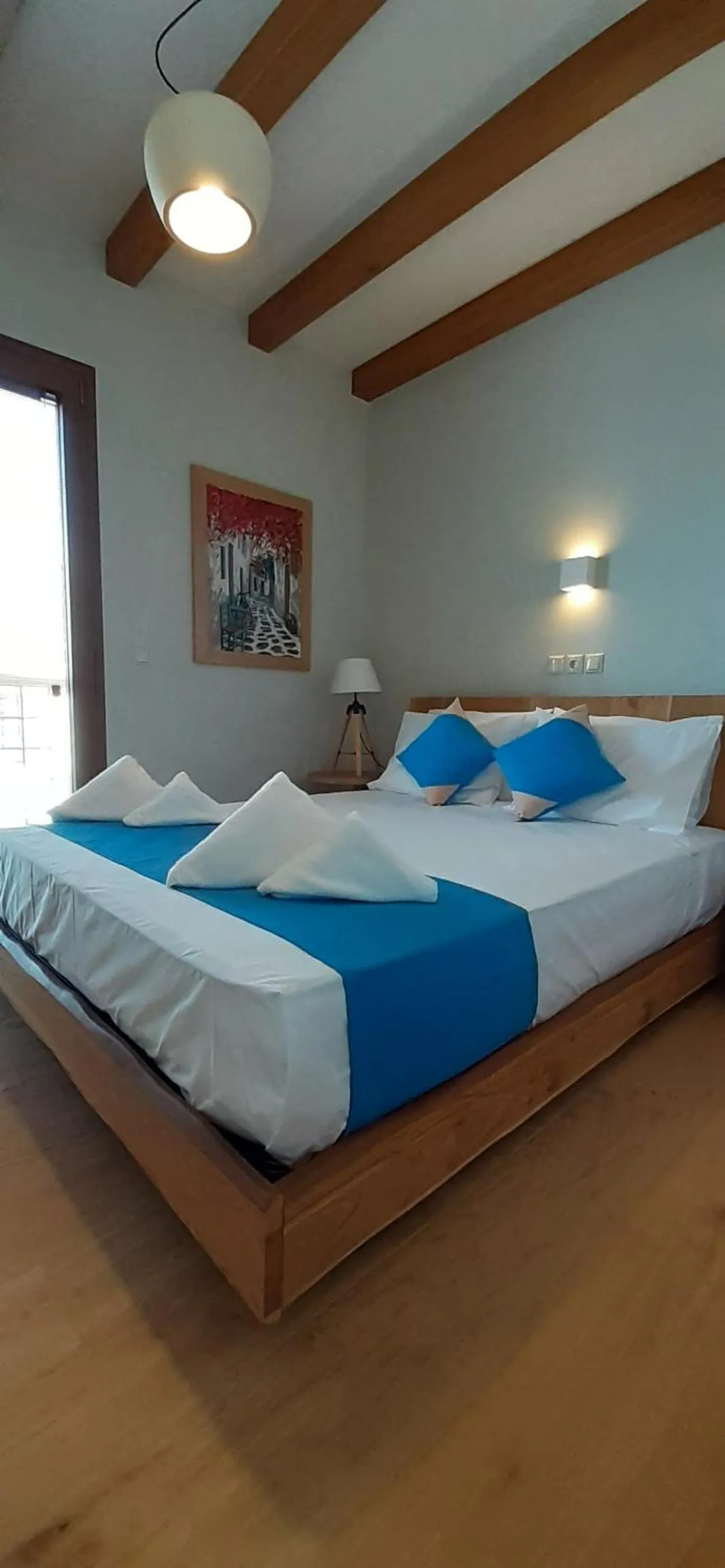 Bed in Andros 4 All Seasons Villas & Suites