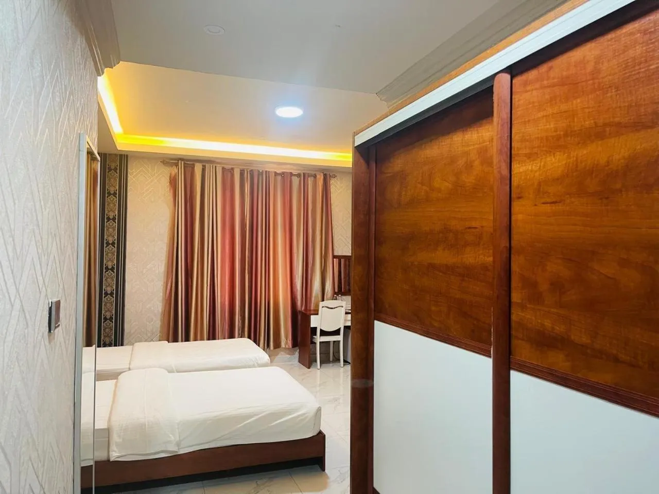 Bed in Grand Inn Hotel