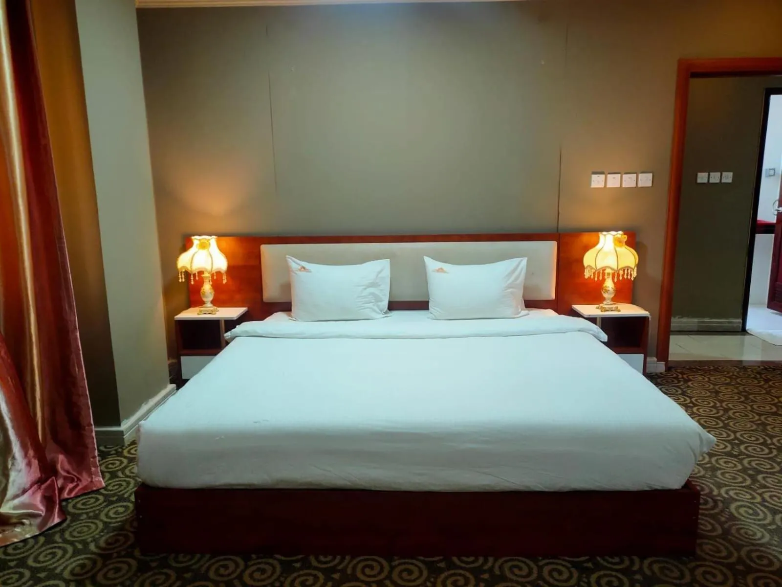 Bed in Grand Inn Hotel