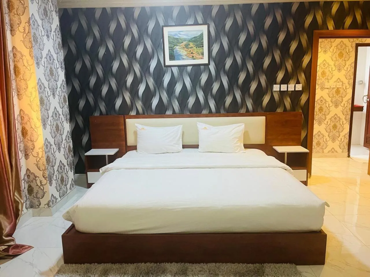 Bed in Grand Inn Hotel