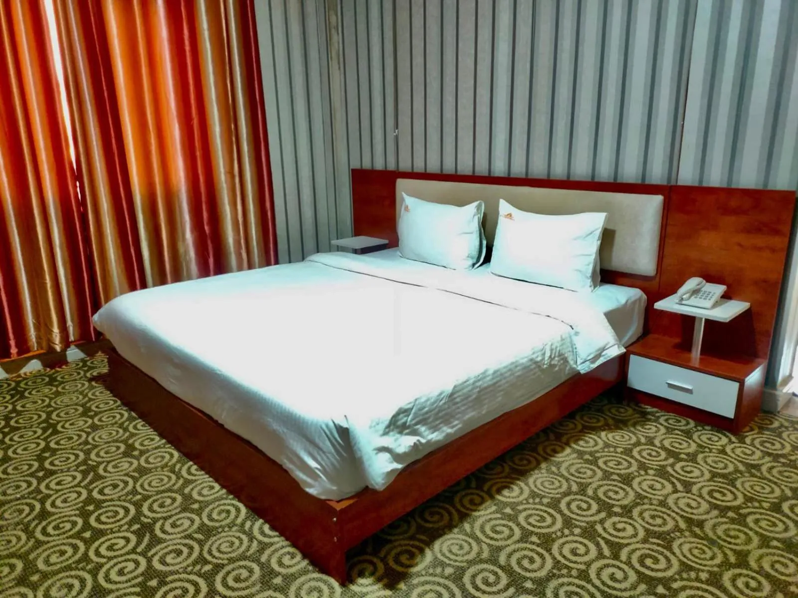 Photo of the whole room, Bed in Grand Inn Hotel