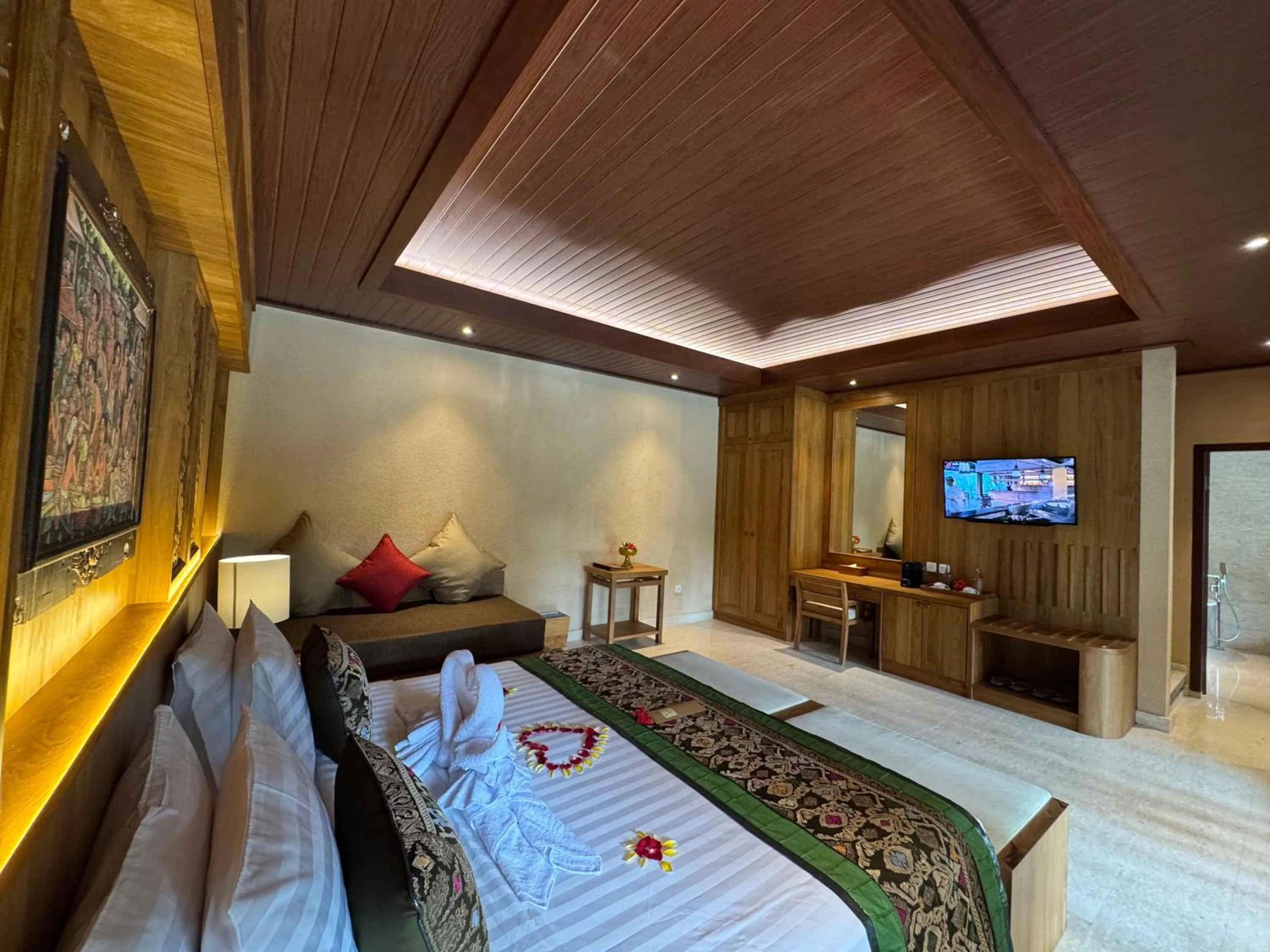 Communal lounge/ TV room, Bed in Sakti Garden Resort & Spa