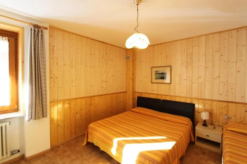 Bedroom, Bed in Appartamenti Residenza Pineta