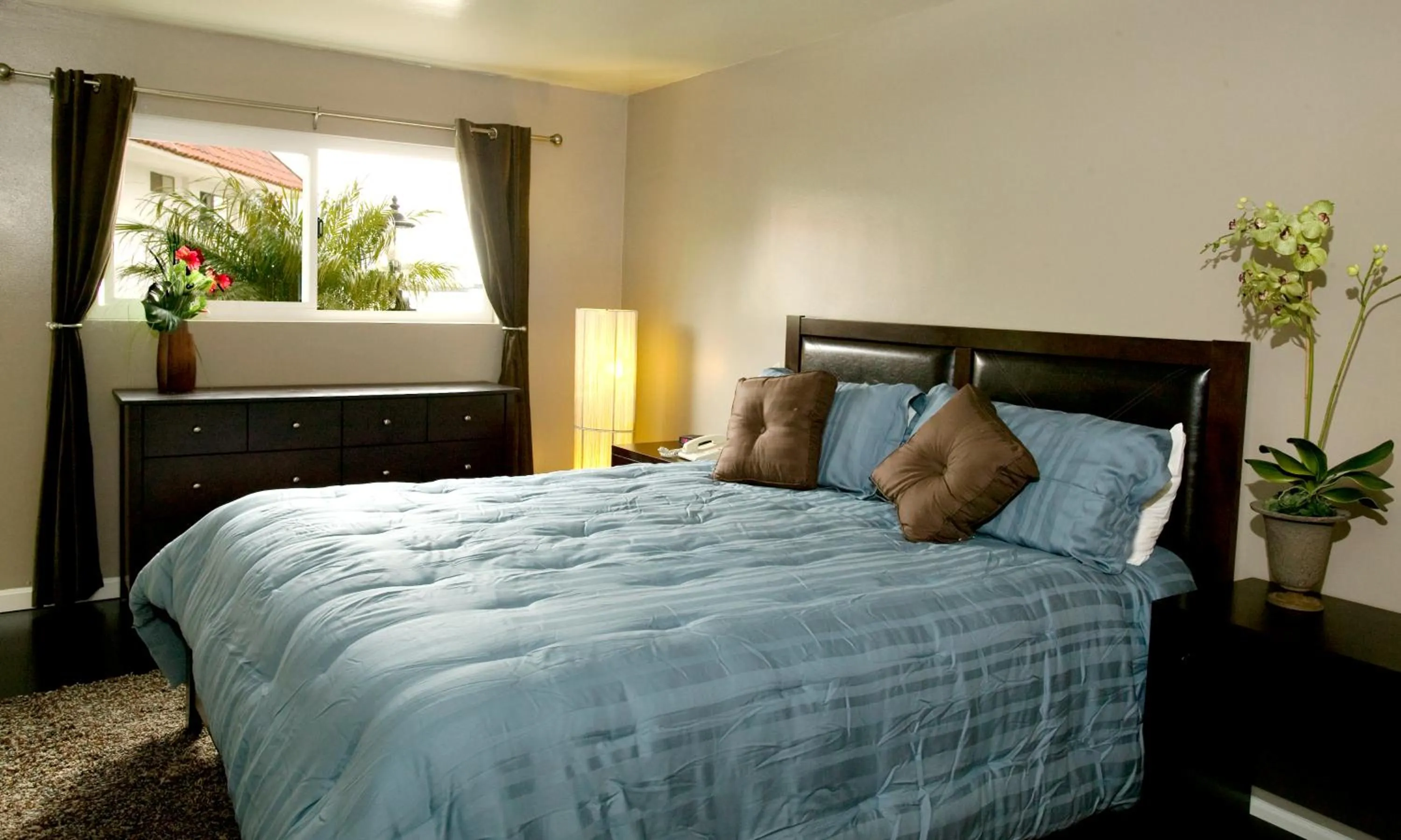 Bed in Oceanside Marina Suites - A Waterfront Hotel