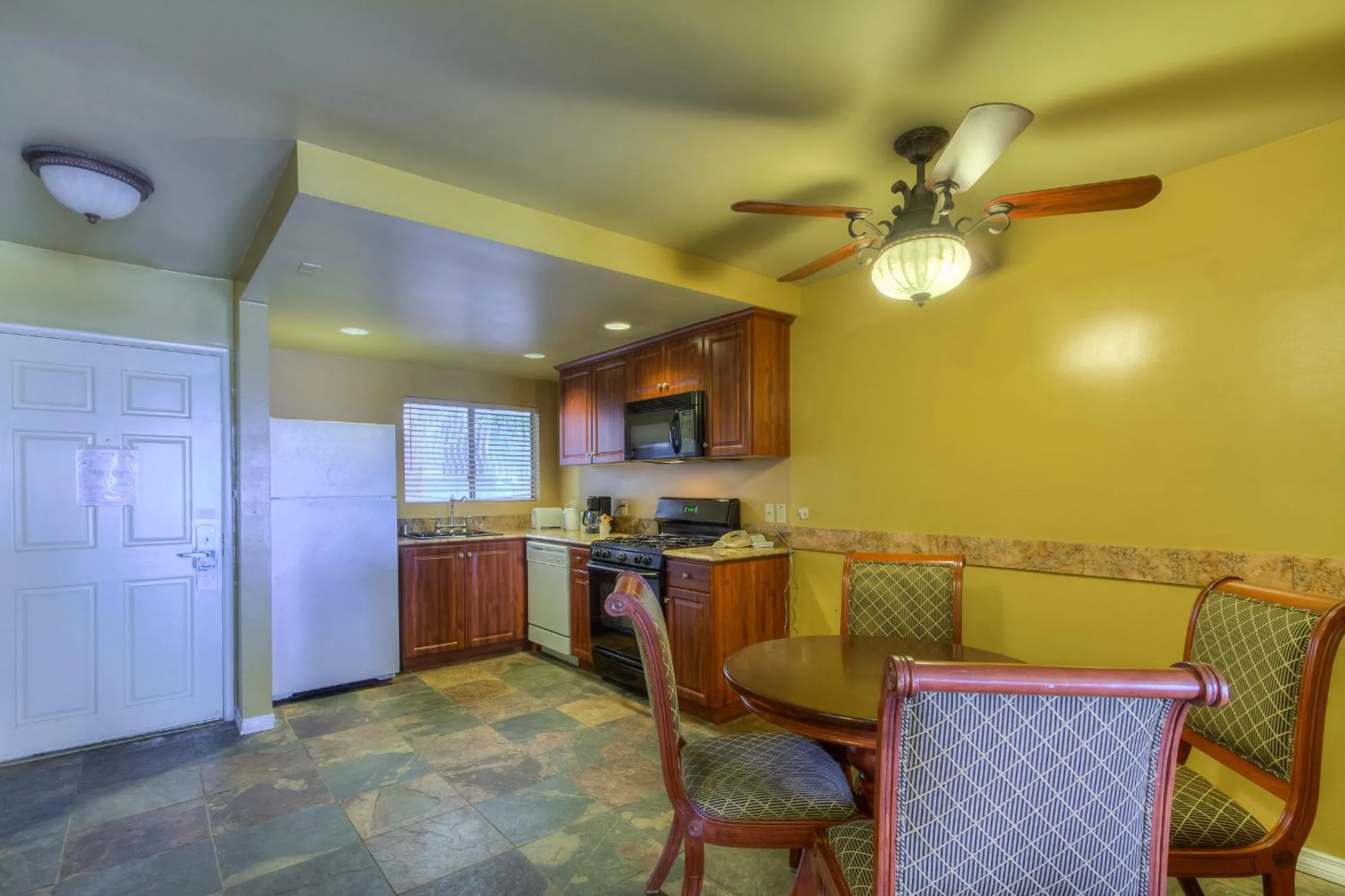 Kitchen or kitchenette in Oceanside Marina Suites - A Waterfront Hotel