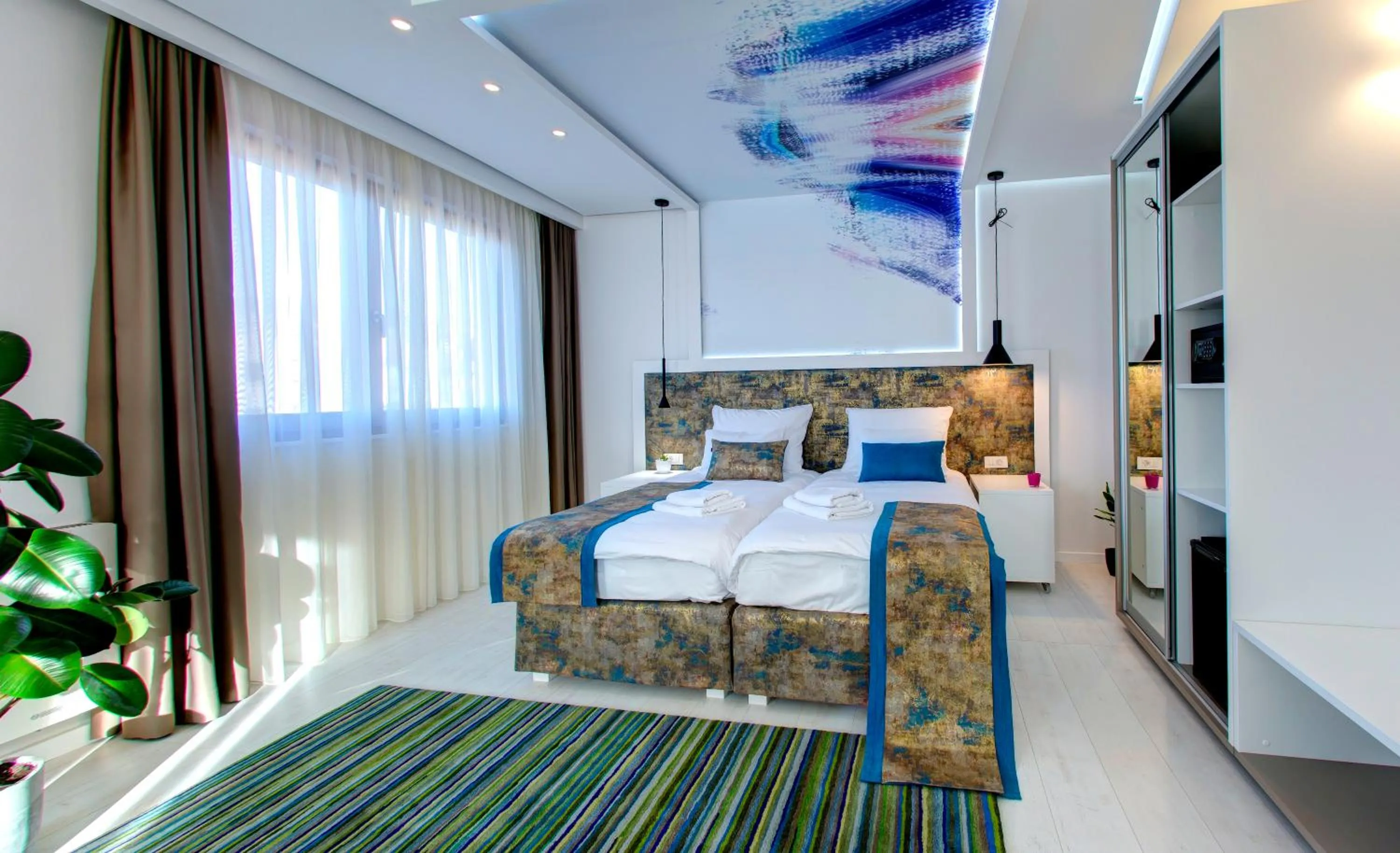 Bed in Diamond Rain Boutique Hotel