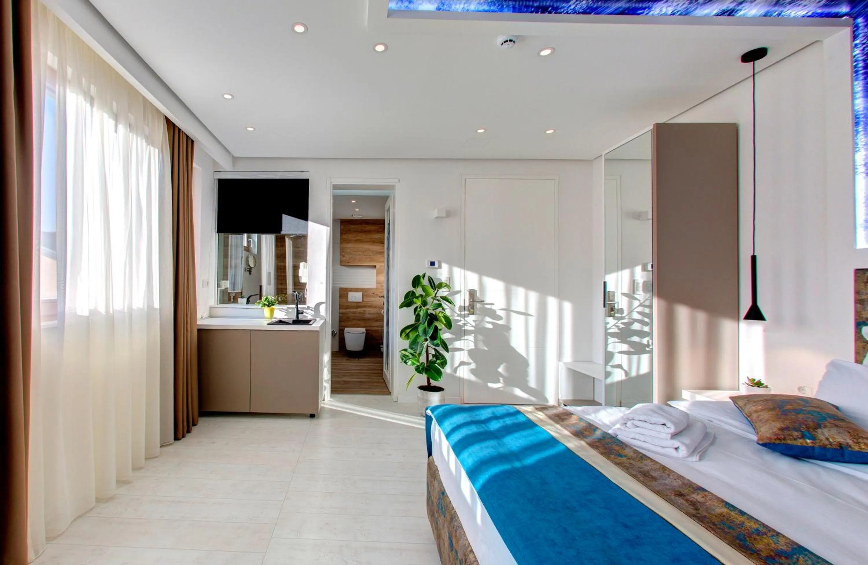 Bed in Diamond Rain Boutique Hotel