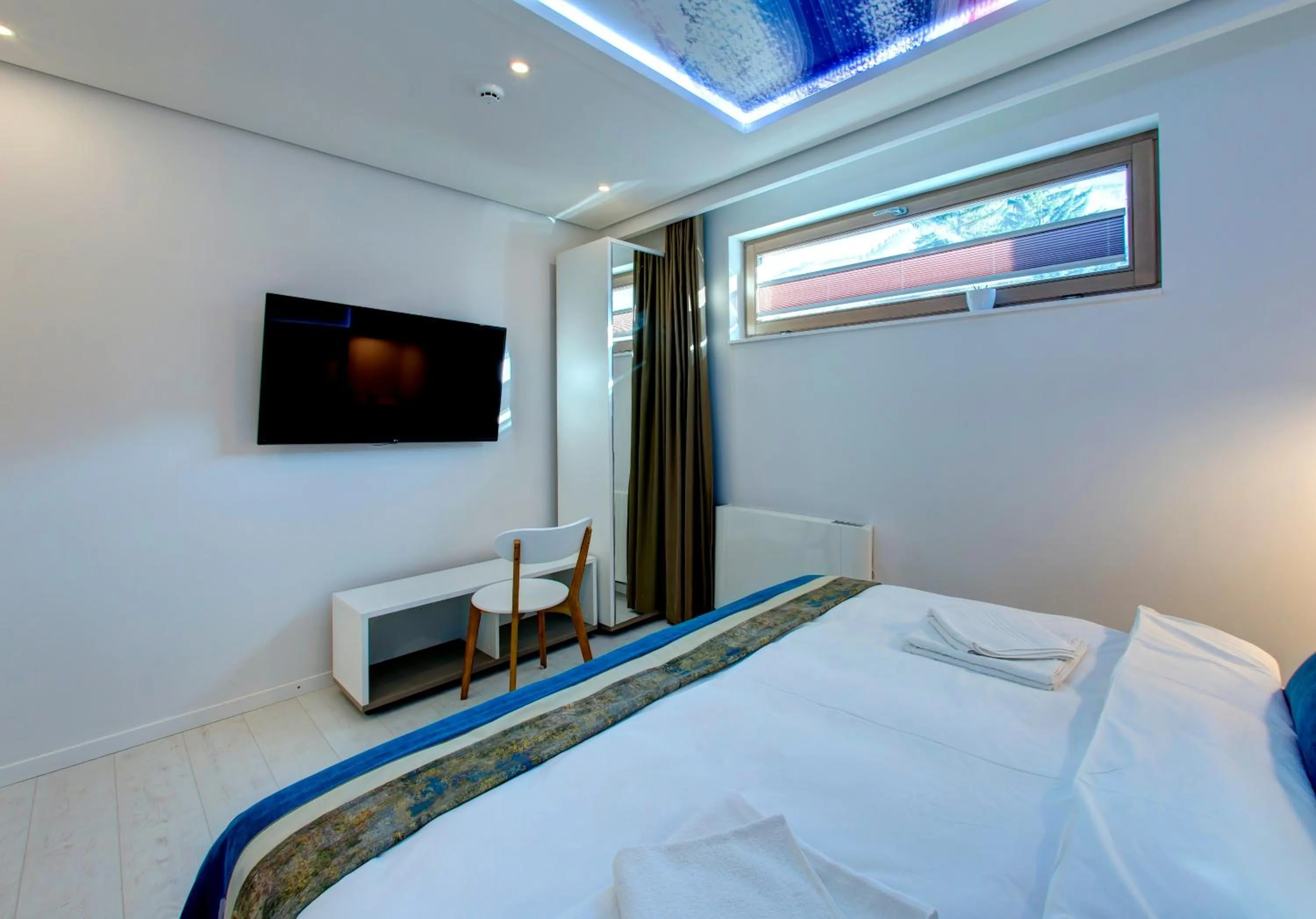 Bed in Diamond Rain Boutique Hotel