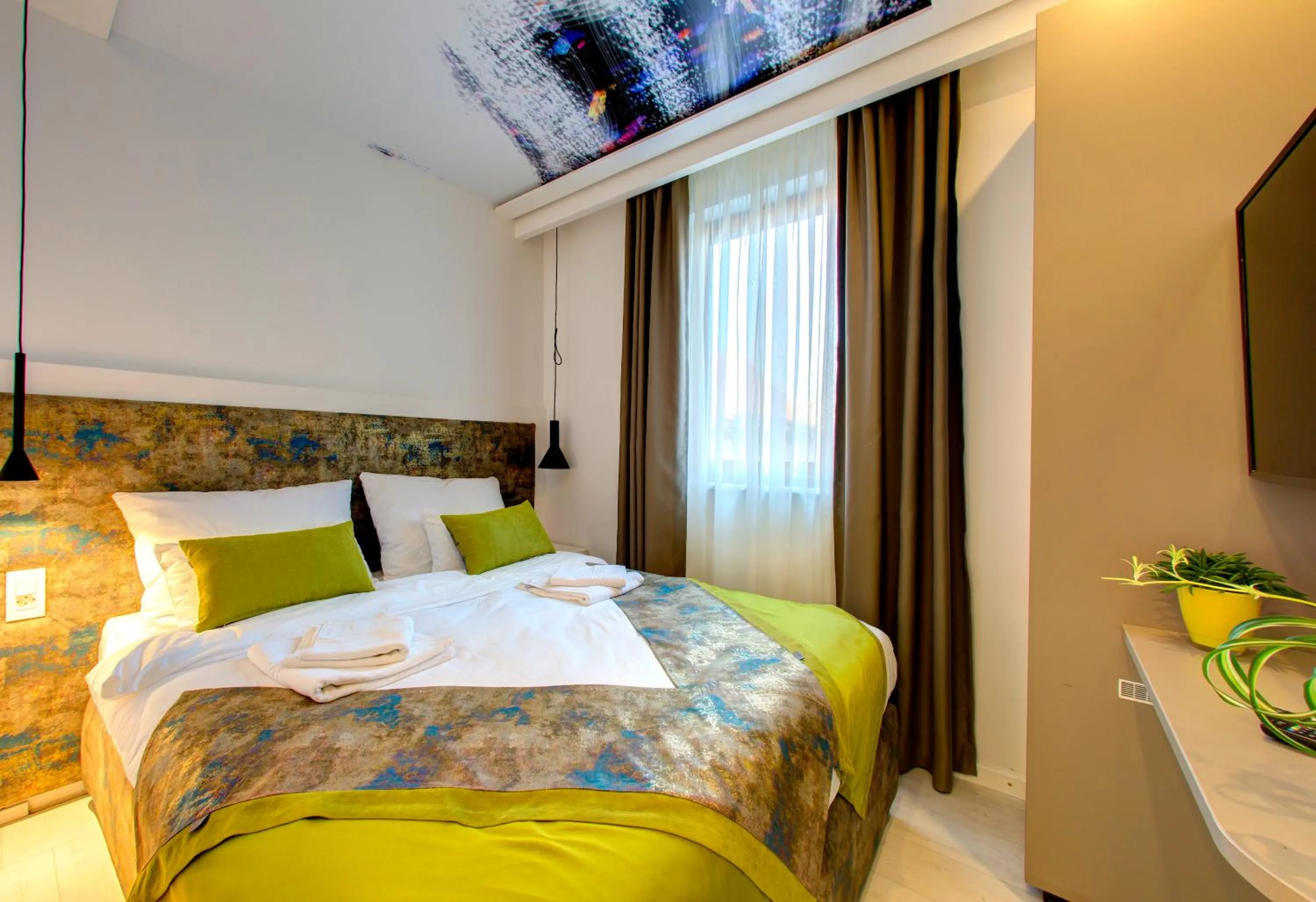 Bed in Diamond Rain Boutique Hotel