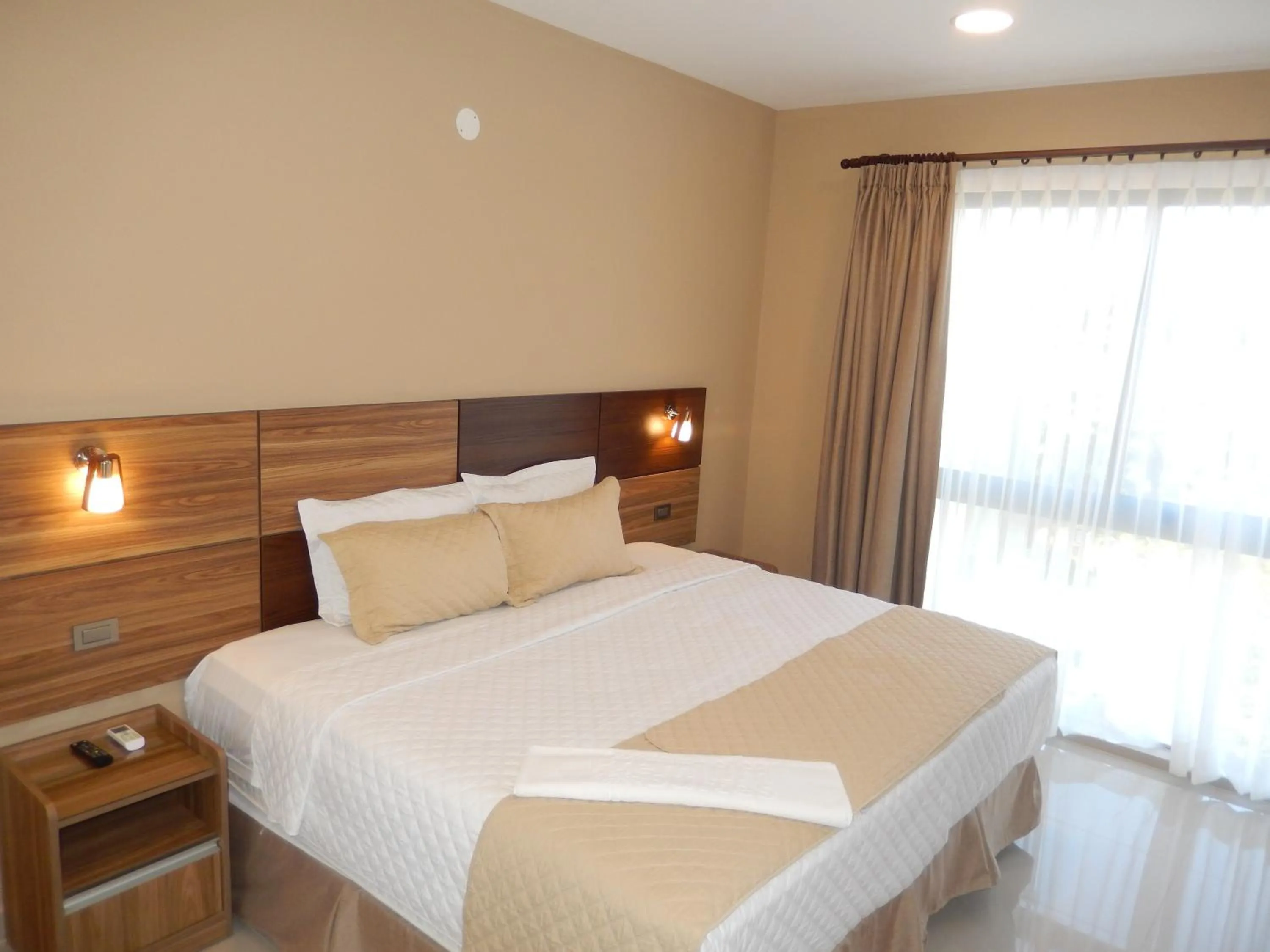 Bed in Premium Suites Deluxe Aparthotel Equipetrol