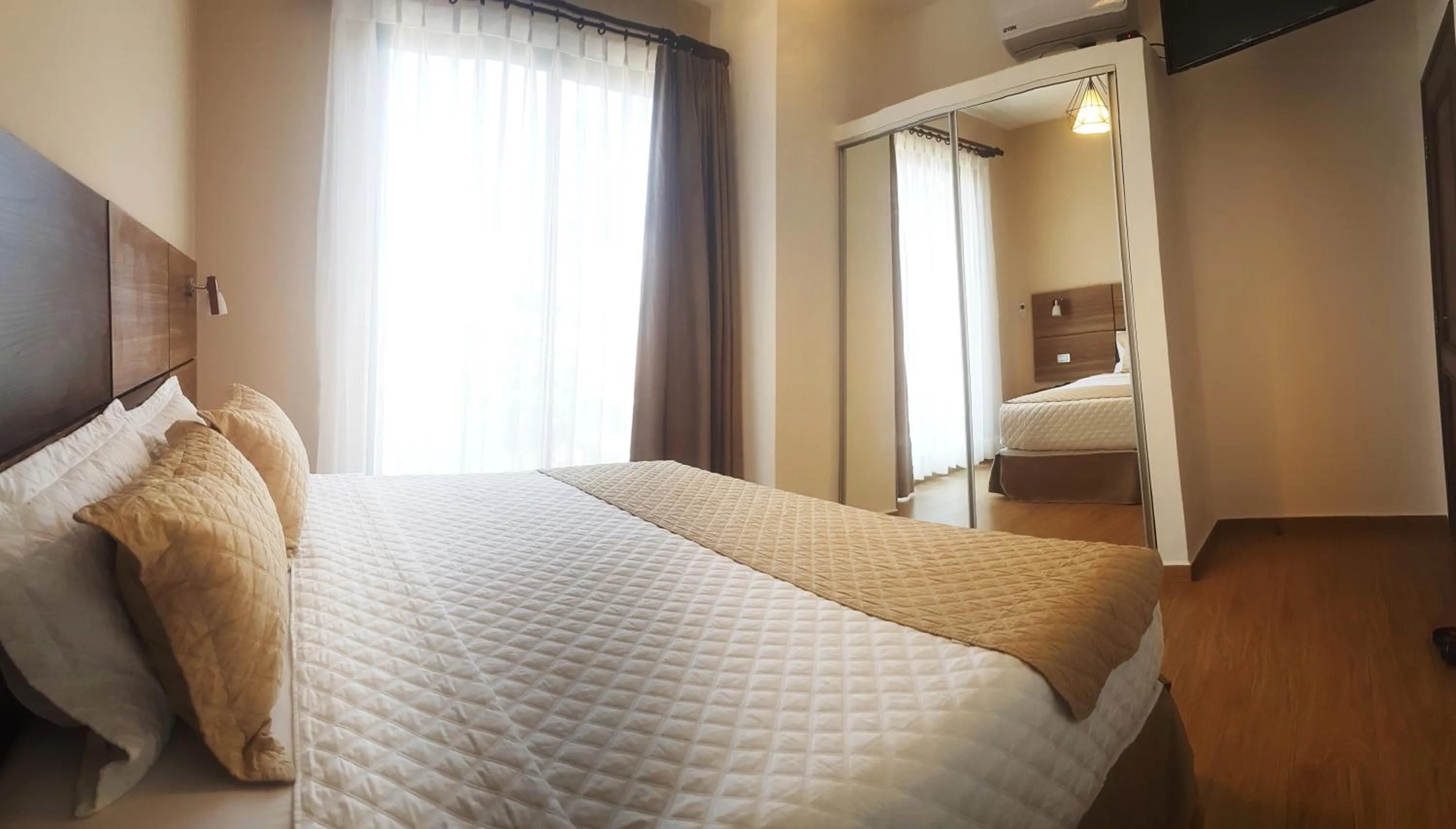 Bed in Premium Suites Deluxe Aparthotel Equipetrol