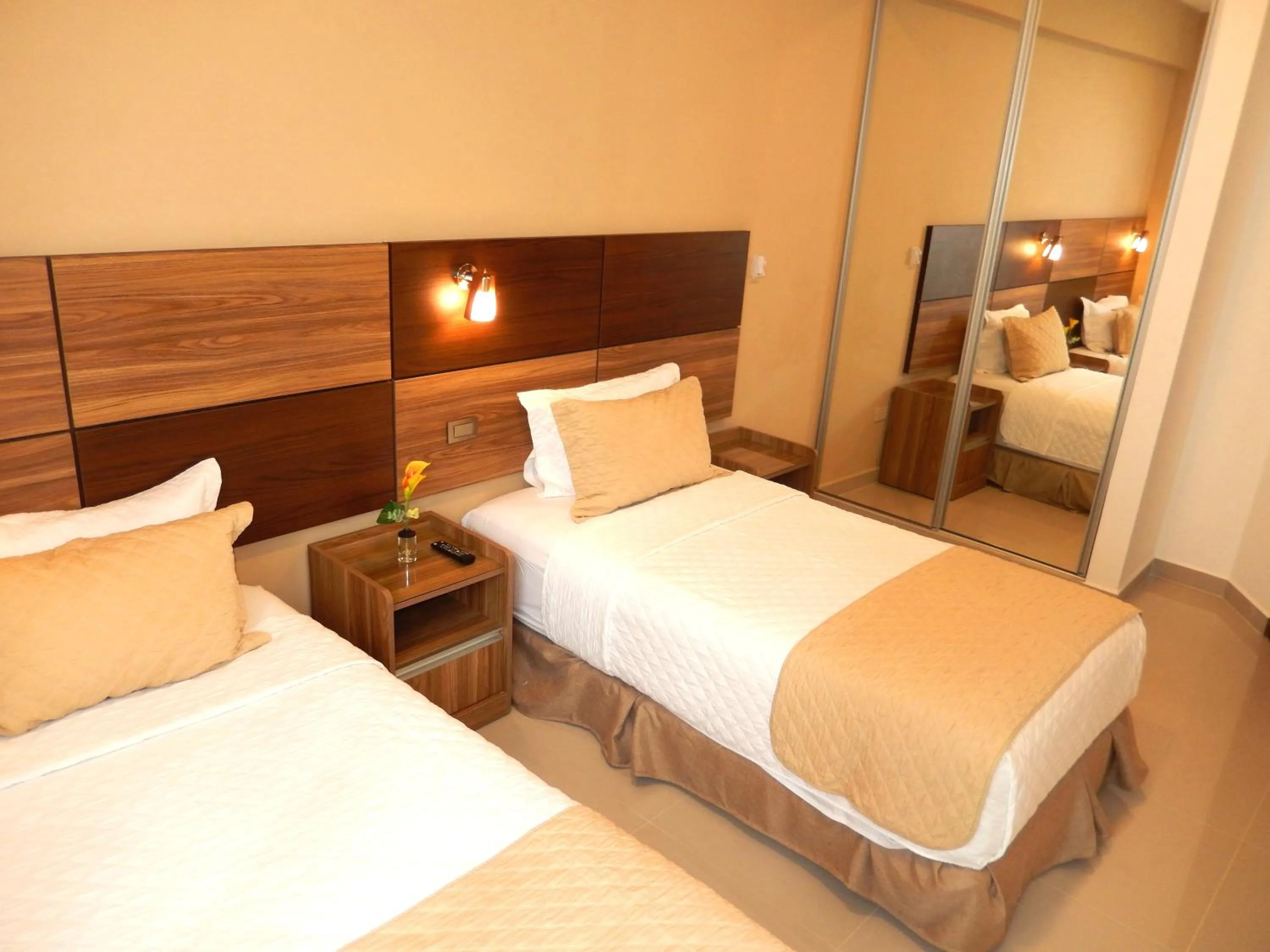 Bed in Premium Suites Deluxe Aparthotel Equipetrol