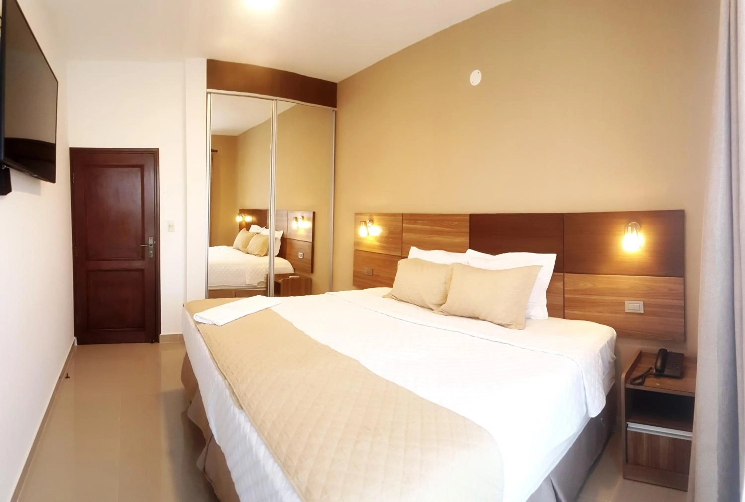 Bed in Premium Suites Deluxe Aparthotel Equipetrol