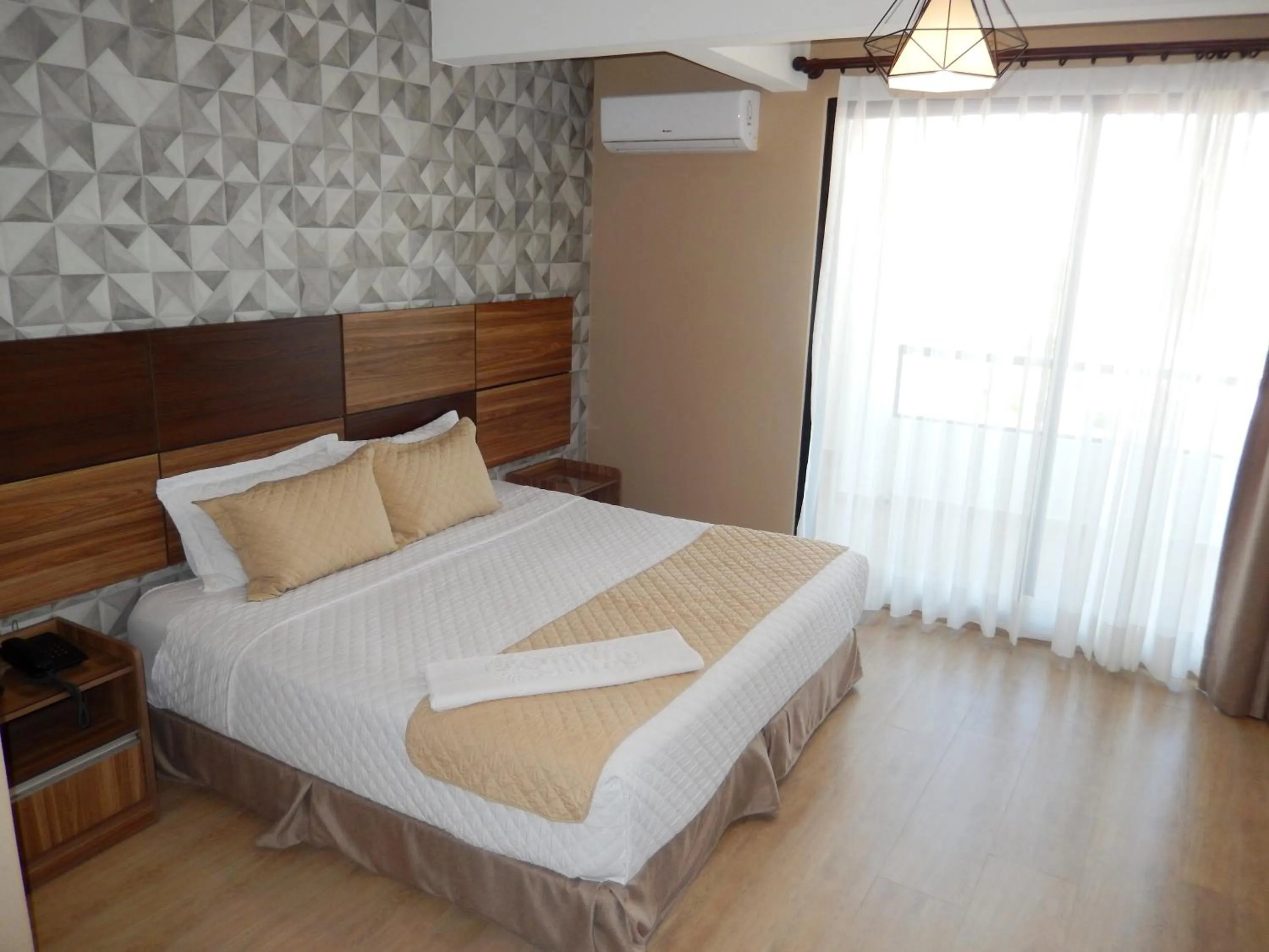 Bed in Premium Suites Deluxe Aparthotel Equipetrol